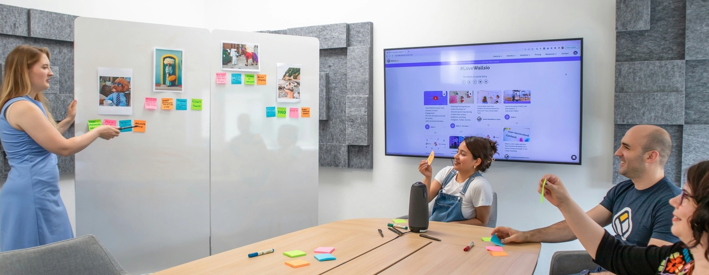 Product manager presenting product features to the team during a sales kickoff.