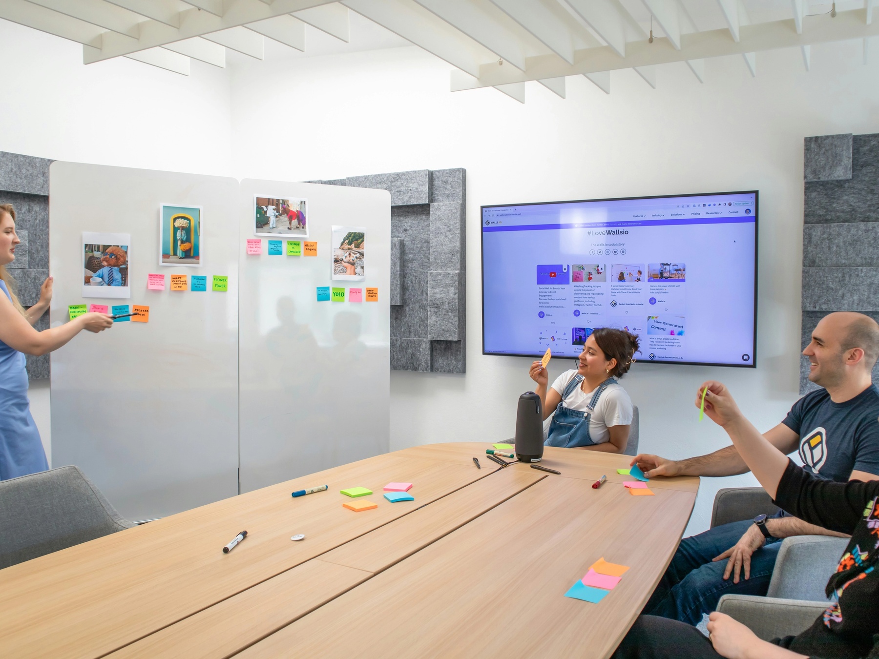 Product manager presenting product features to the team during a sales kickoff.