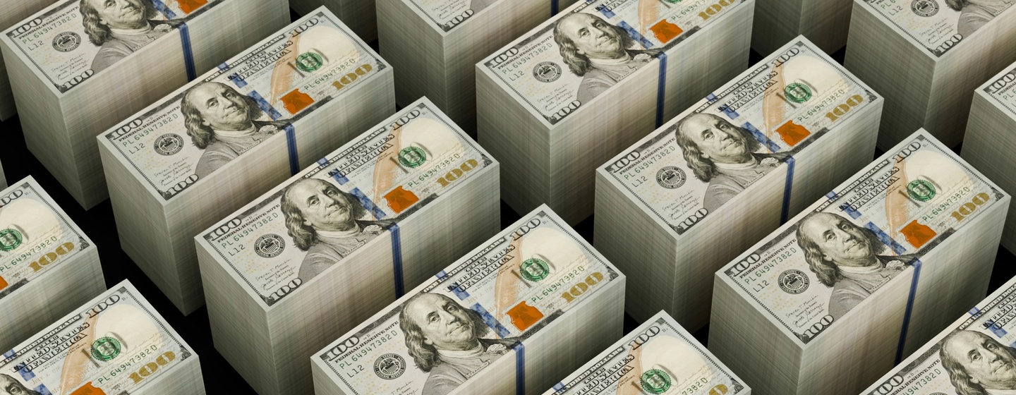 Stacks of USD 100 dollar bills