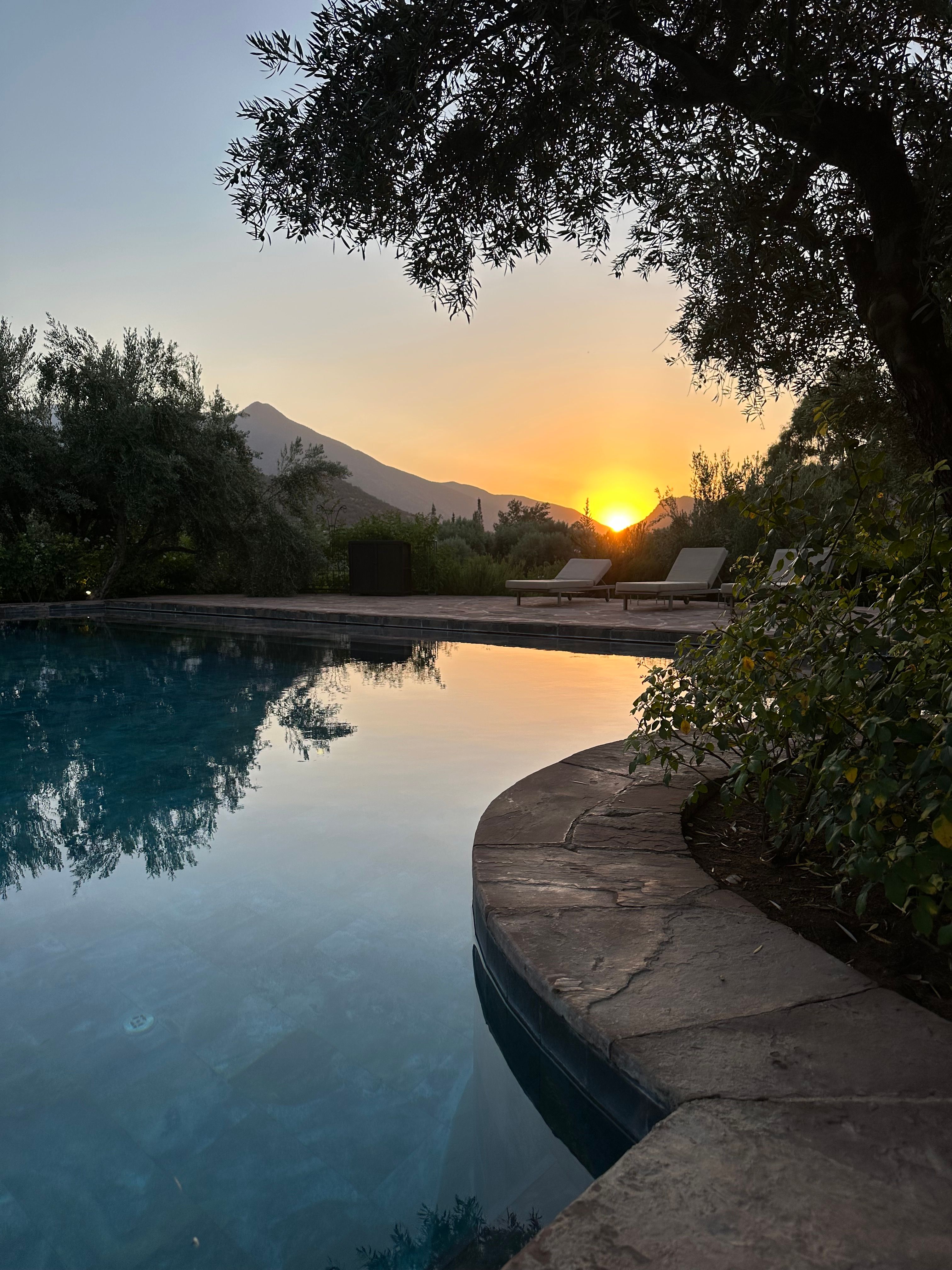 Views of the pool at sunset in the Atlas Mountains