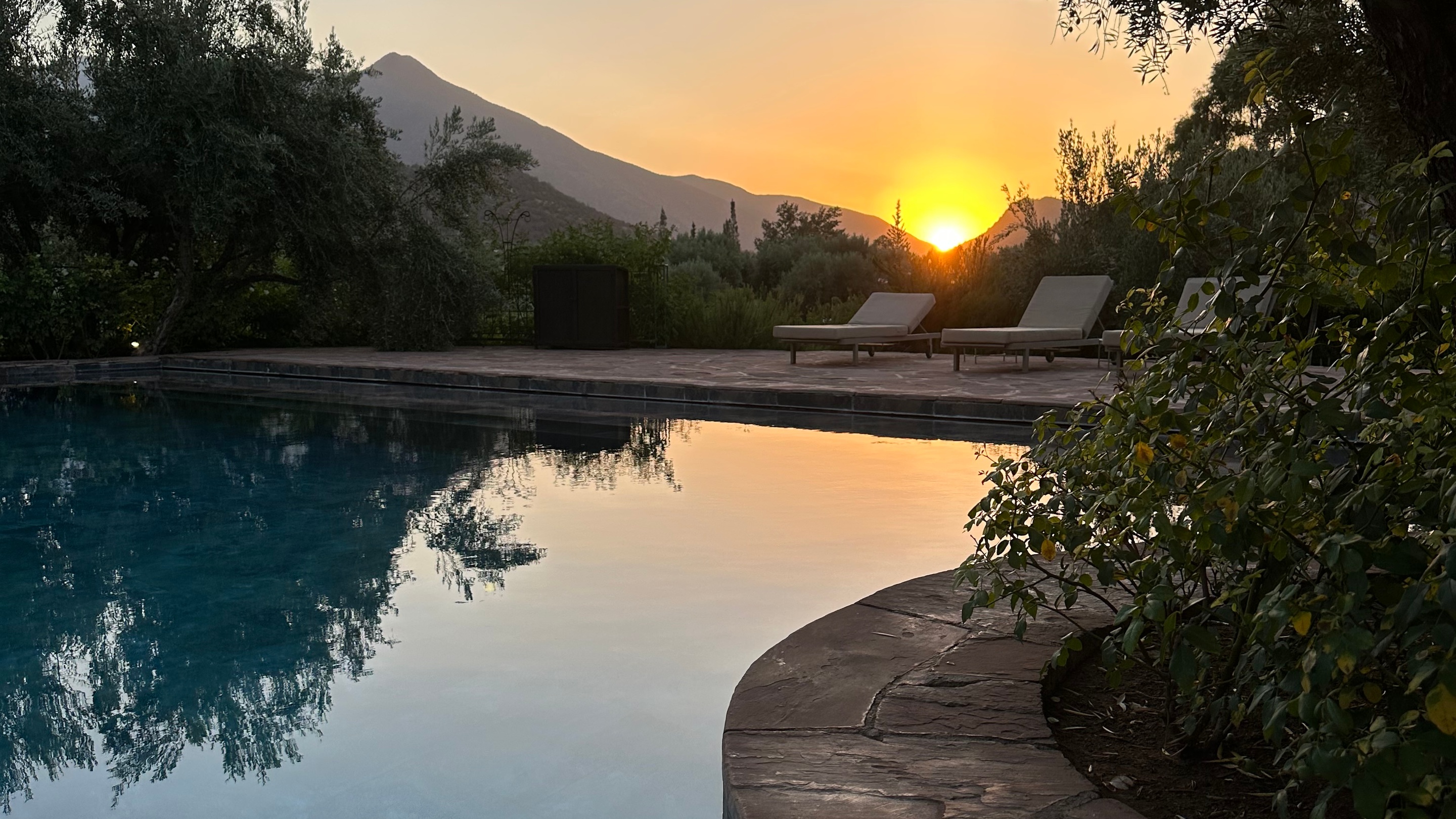 Views of the pool at sunset in the Atlas Mountains