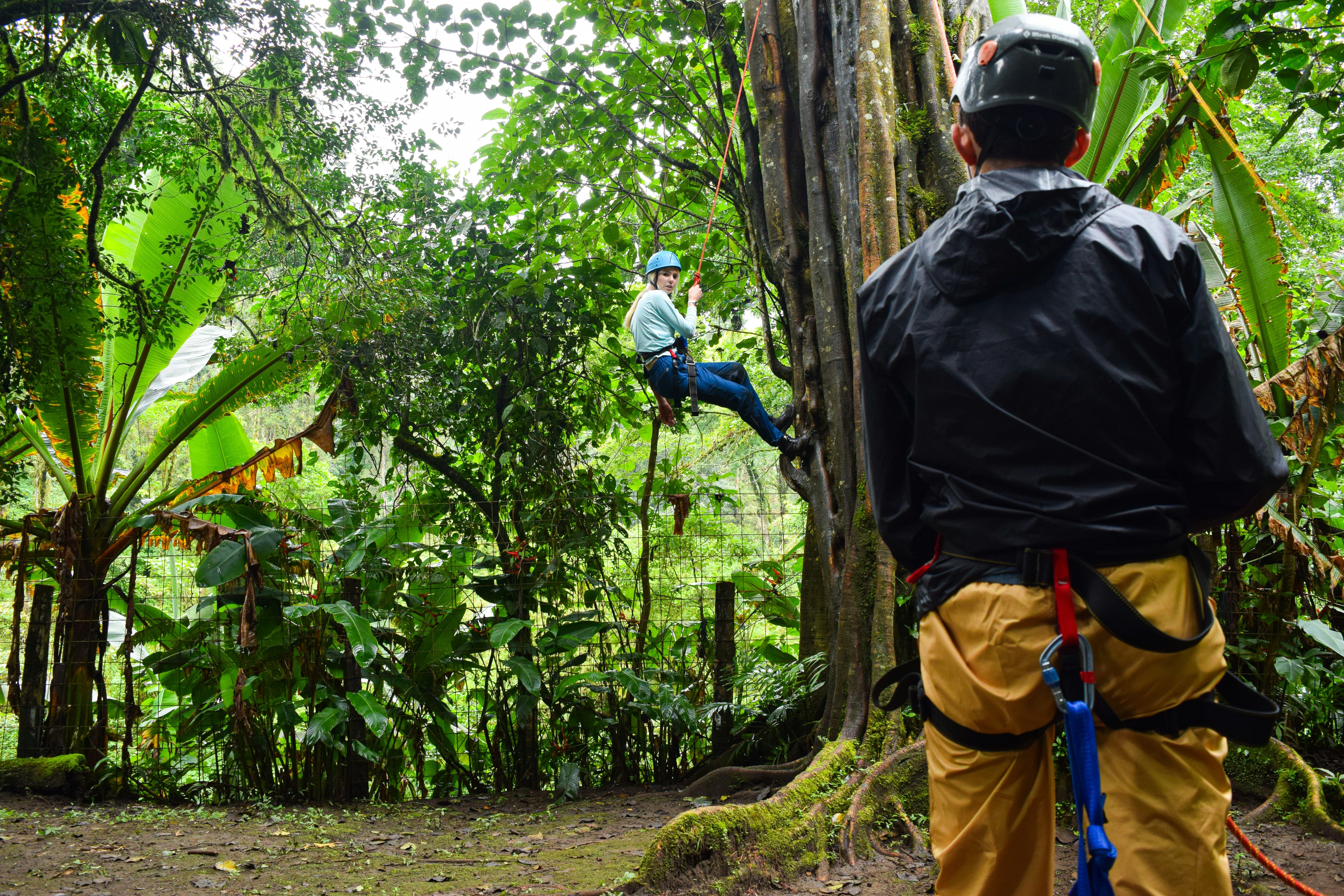 Woman rappelling in Costa Rica as part of team event