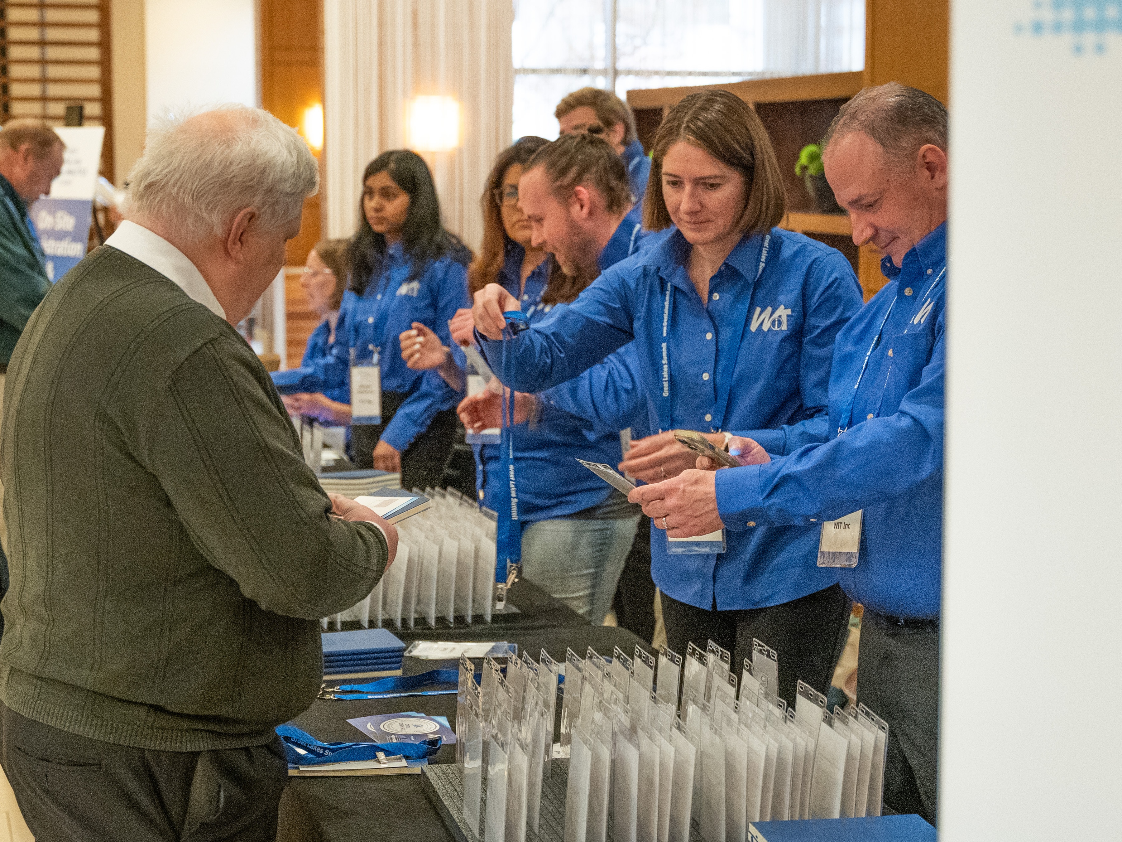 Team manages registration check-in for conference