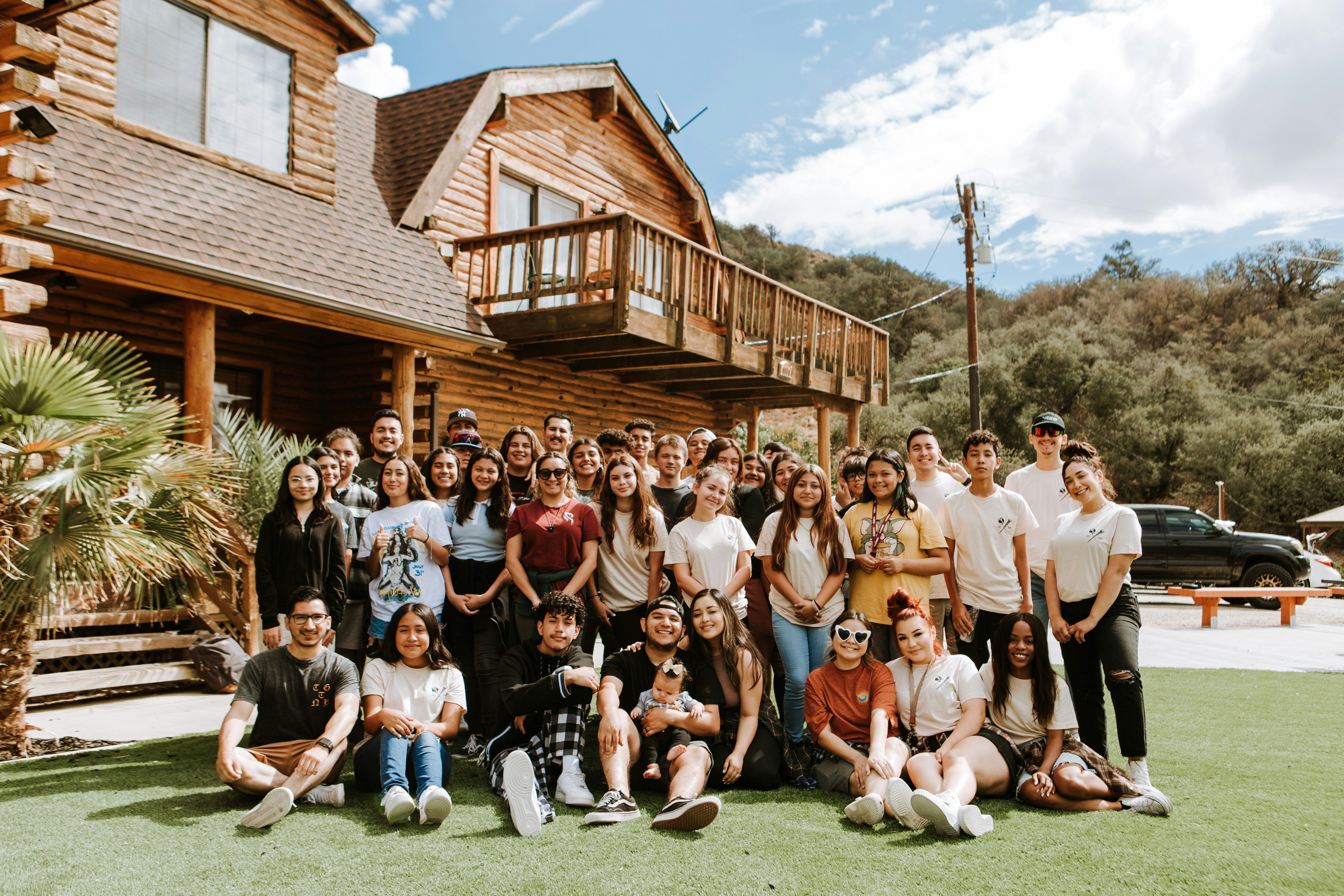 team photo at company offsite in the woods