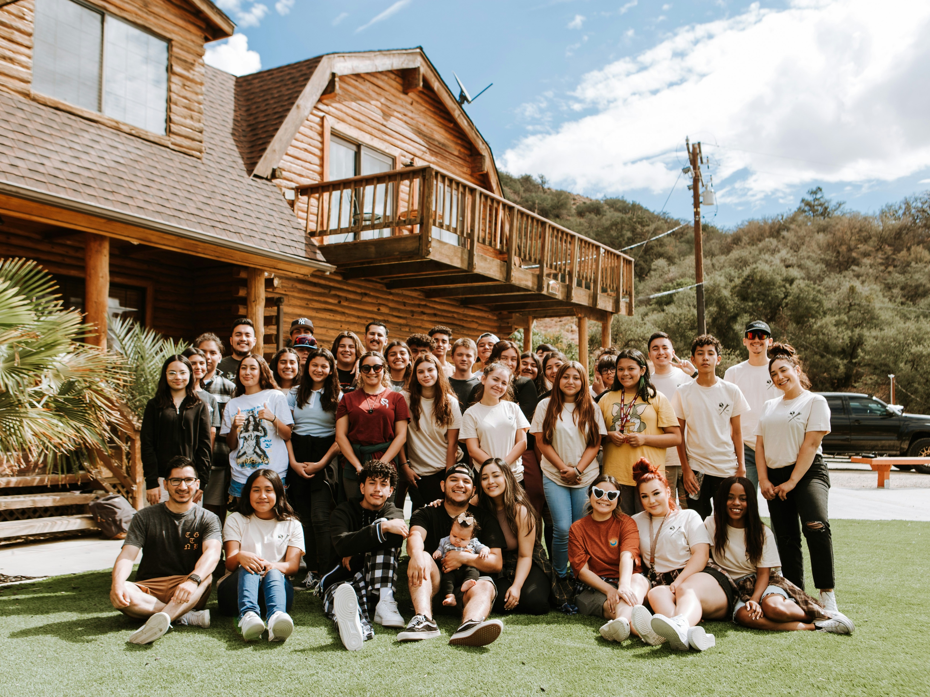 team photo at company offsite in the woods