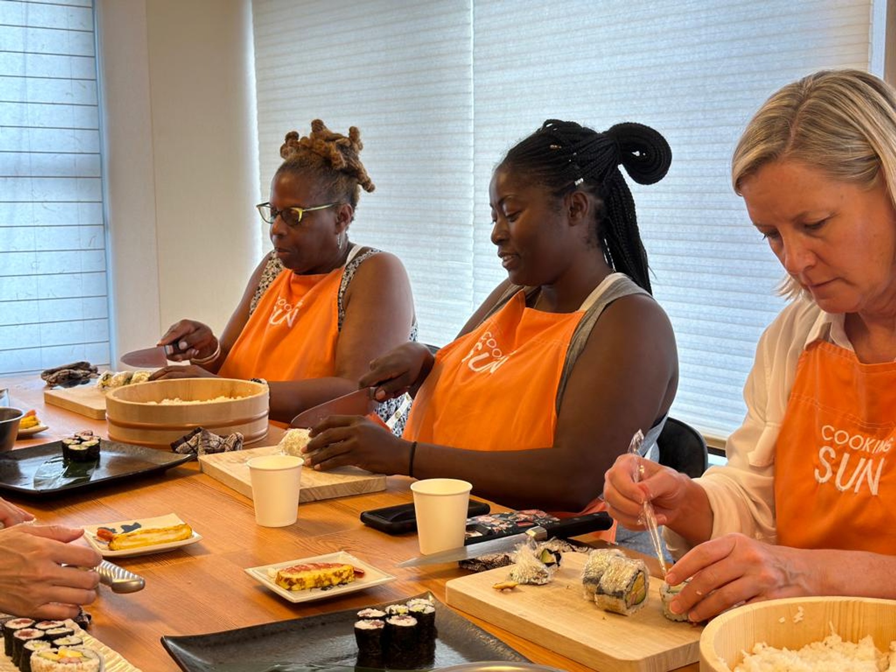 women in Sushi-making class in Japan
