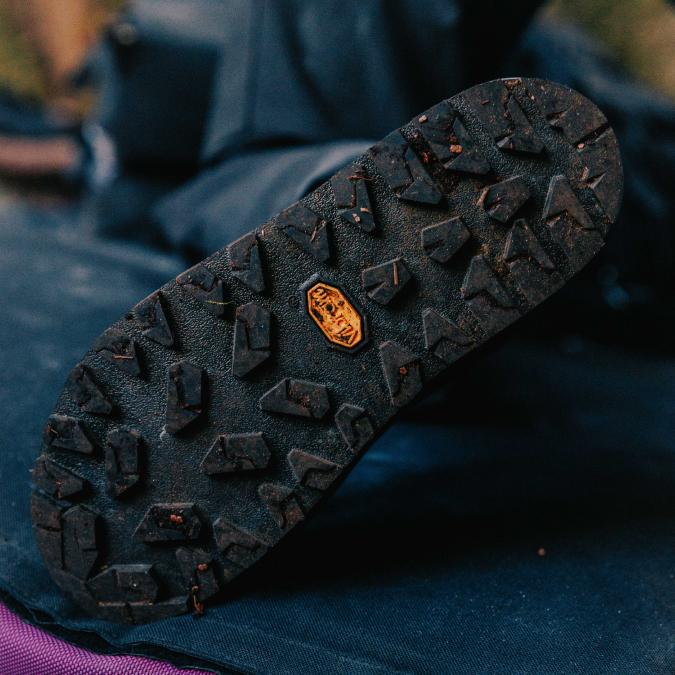 Dirty boot sole with a Vibram logo.