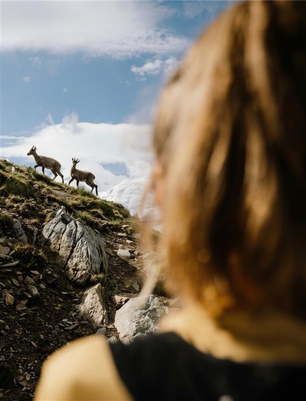 Arc'teryx employee climbing outside with their team member below