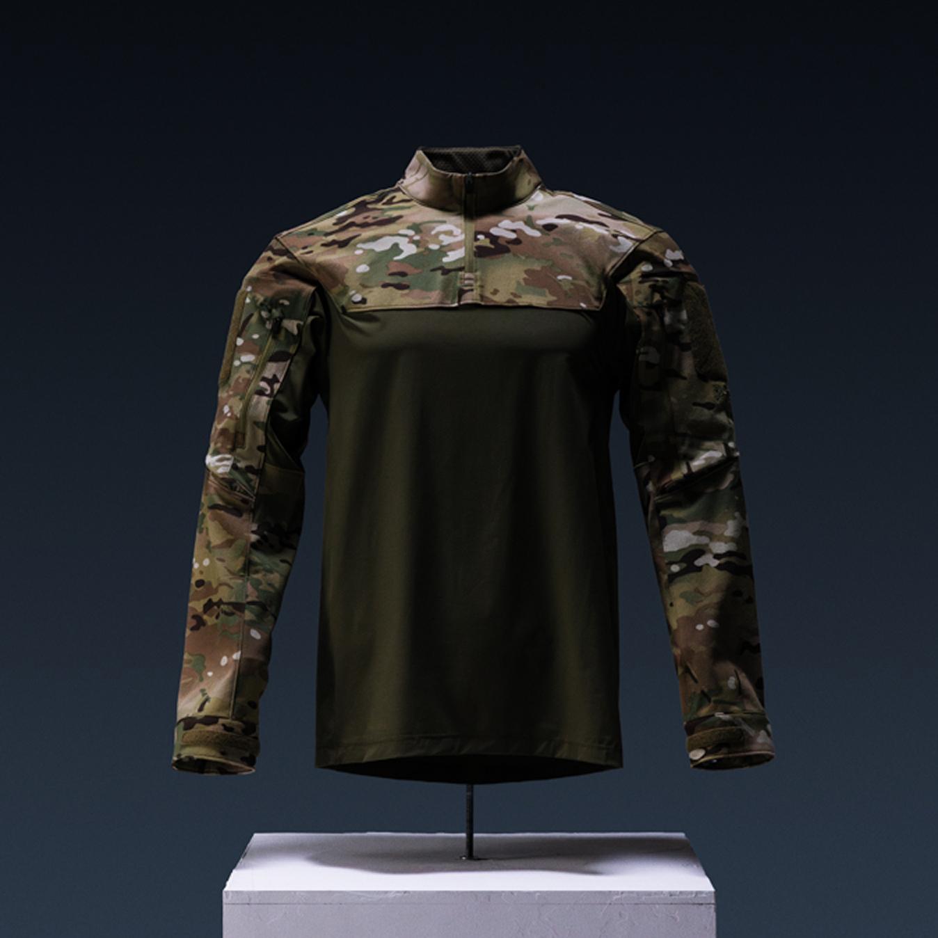 Tactical combat shirt with camouflage sleeves and olive green torso.