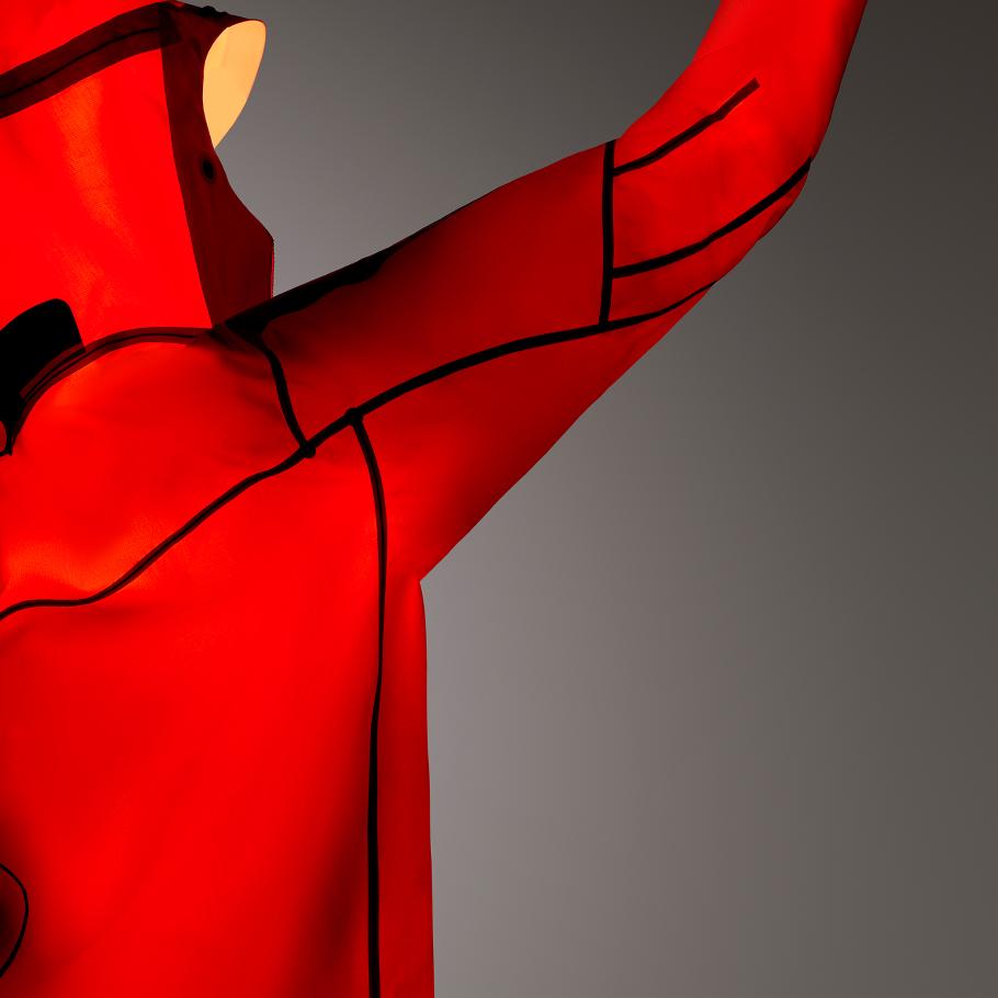 a close up of a red Alpha SV Jacket on a gray background