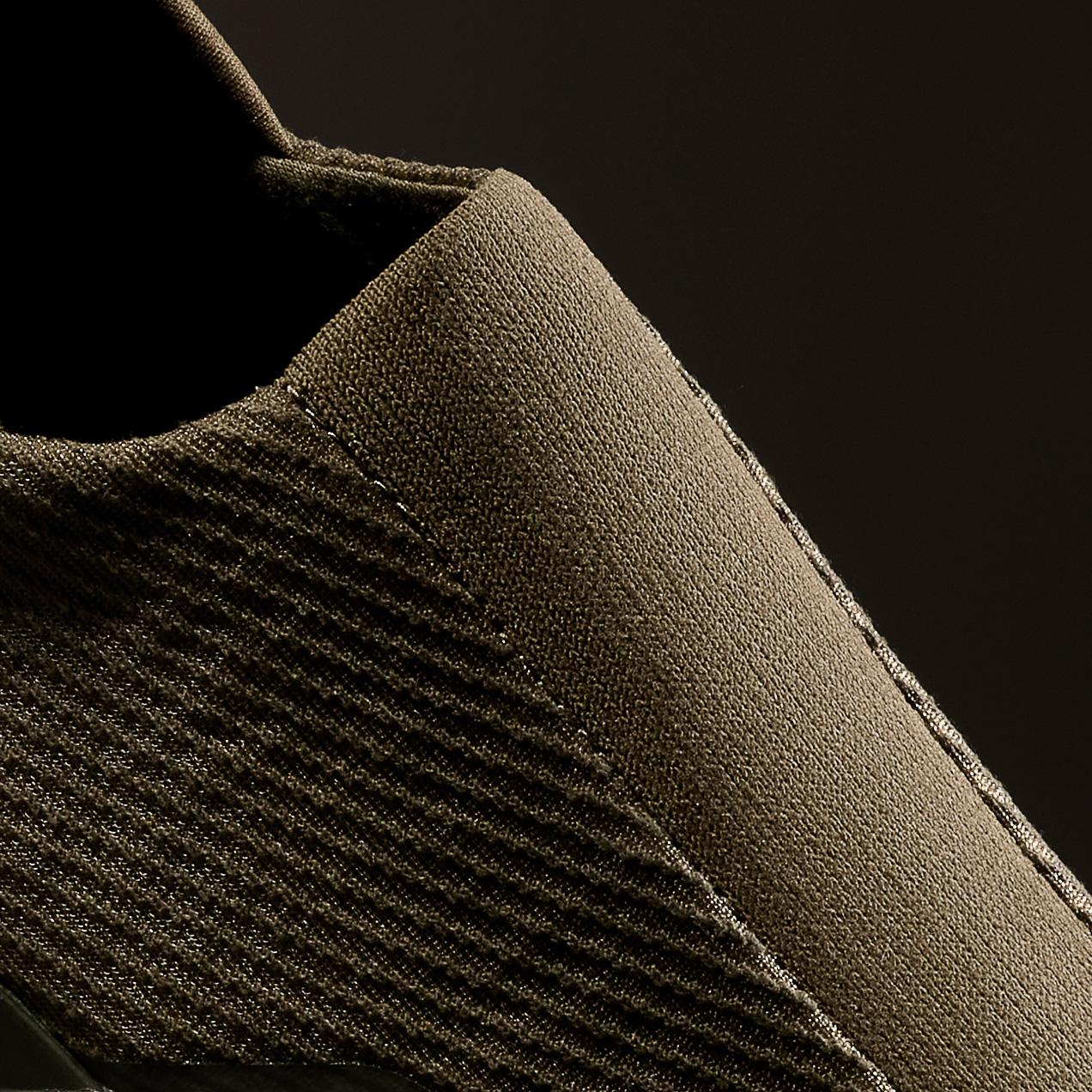 a close up of a pair of recovery shoes on a black background