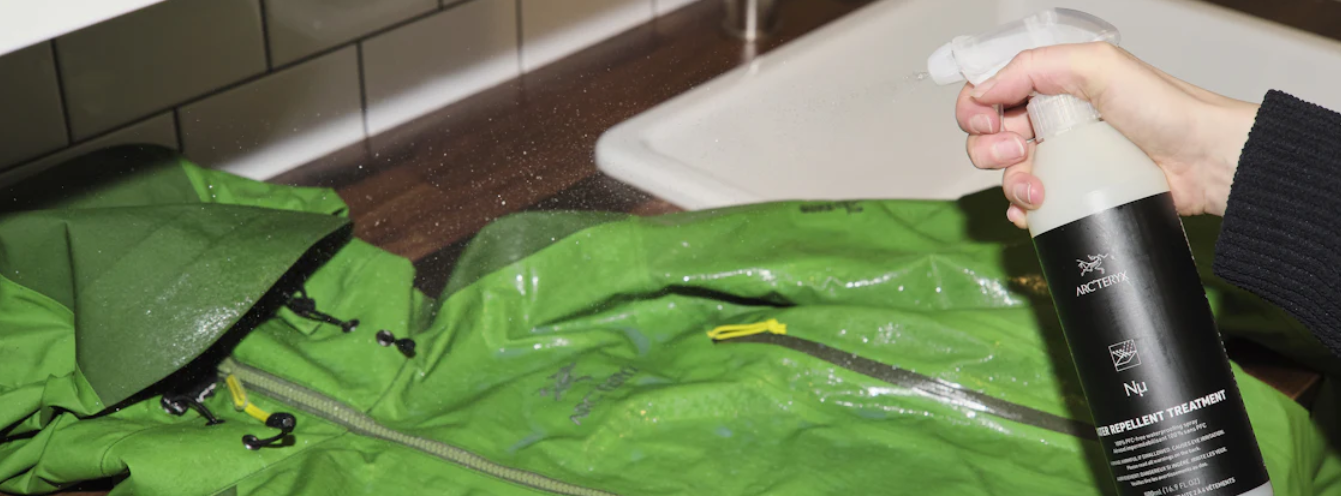 spraying Arc'teryx jacket with water repellant