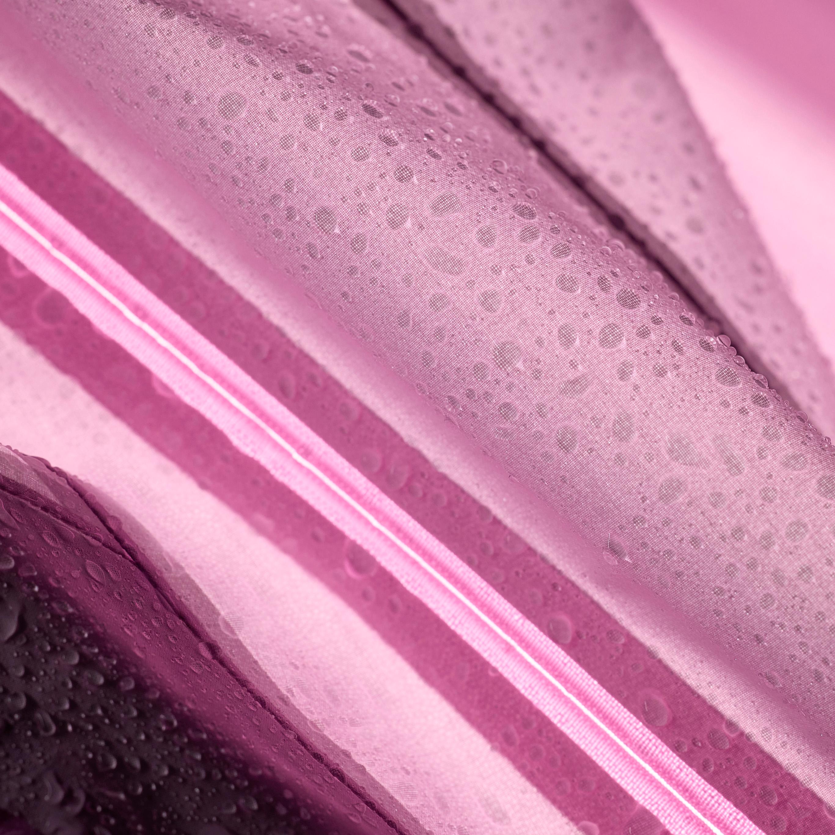 Pink waterproof fabric with water droplets and a diagonal bright pink stripe.