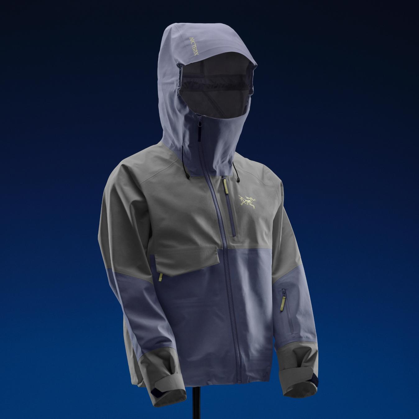 Arc'teryx hooded jacket in two-tone grey and slate blue with logo.