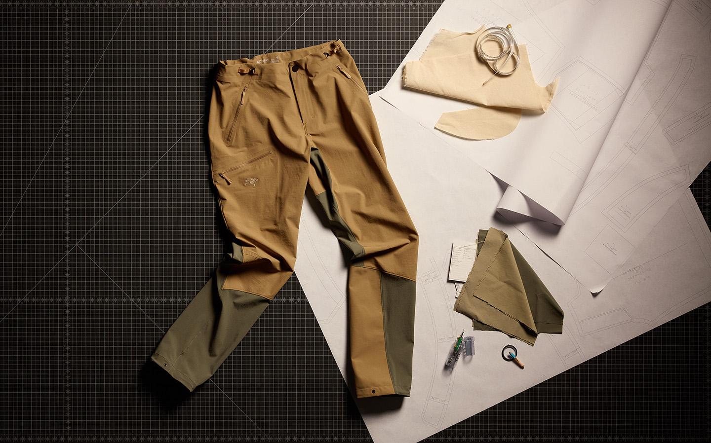 a pair of softshell pants is sitting on top of a piece of paper on a table