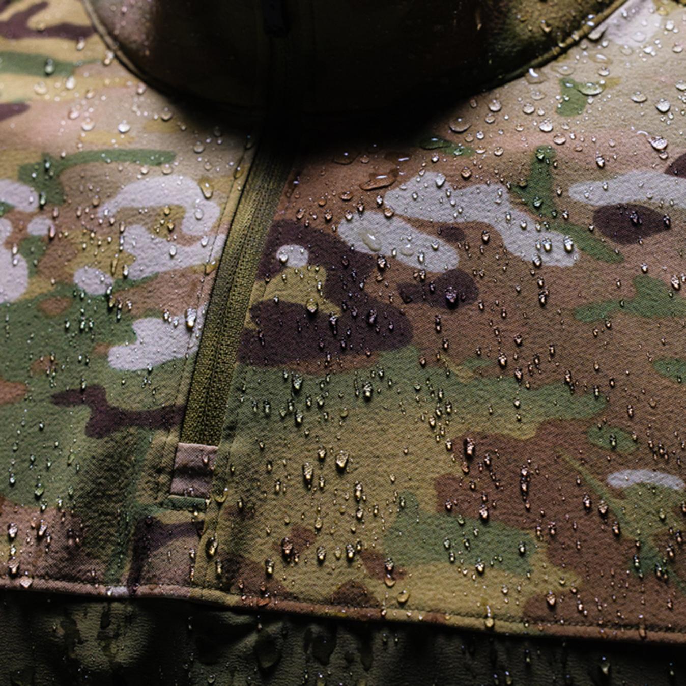 Water droplets beading on a camouflage fabric.