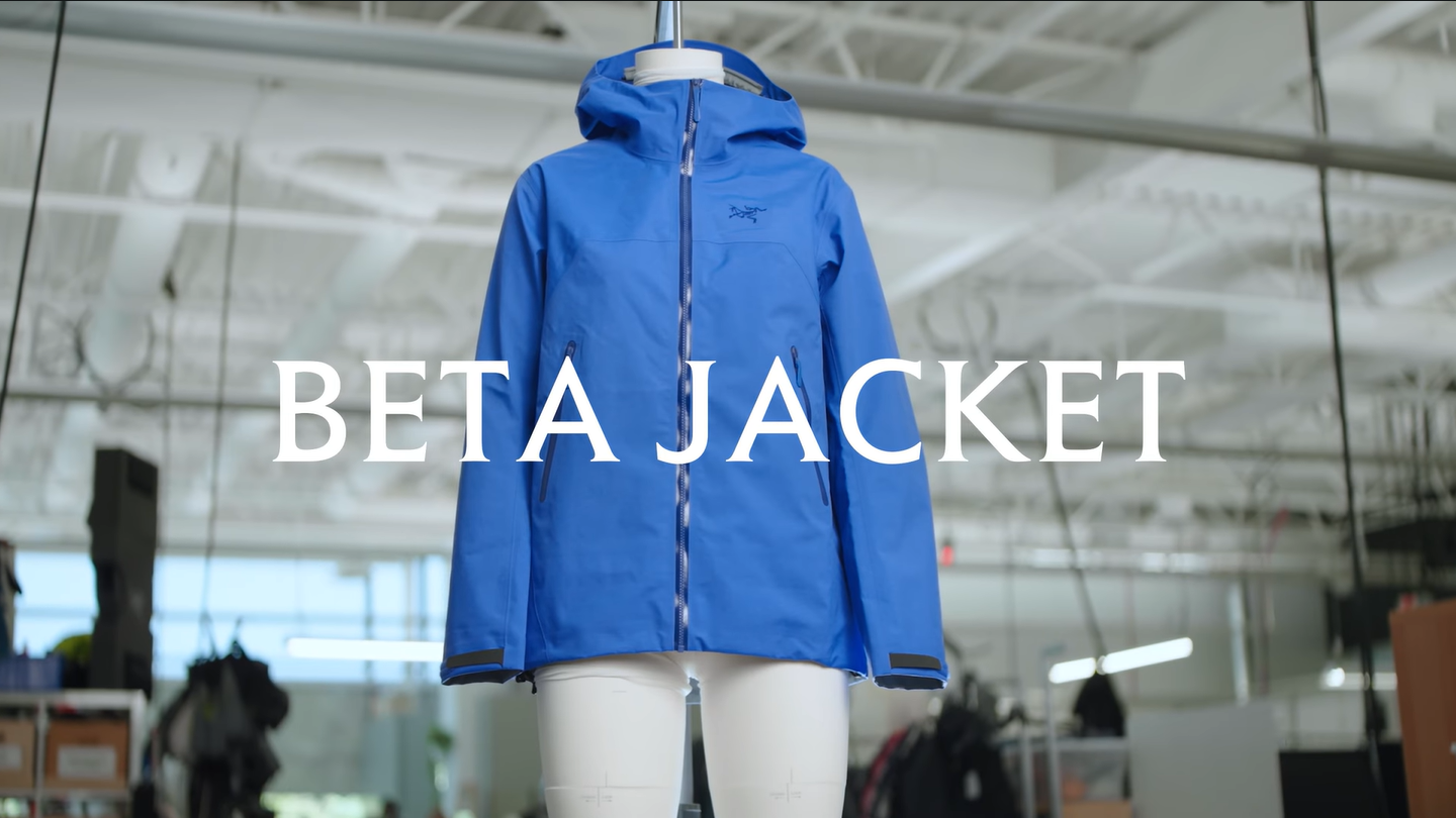 Blue Arc'teryx Beta jacket on a mannequin with "BETA JACKET" text overlaid.