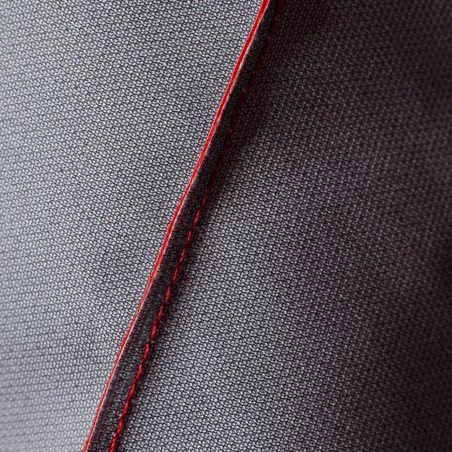 a close up of a piece of fabric with a red stitching
