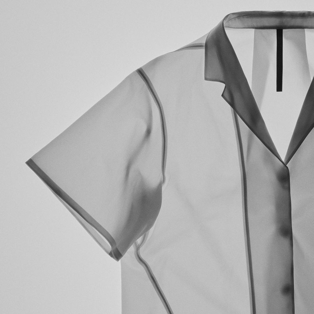 Grey translucent short-sleeved collared shirt.