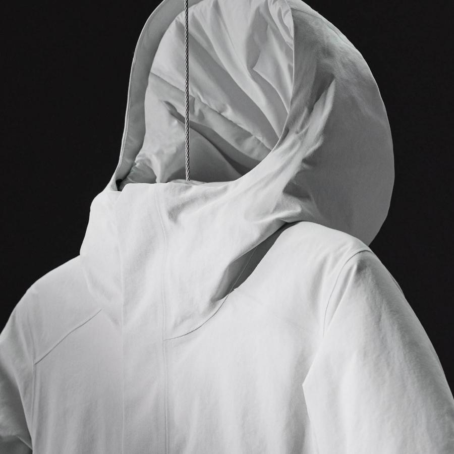 a close up of a white jacket with a hood