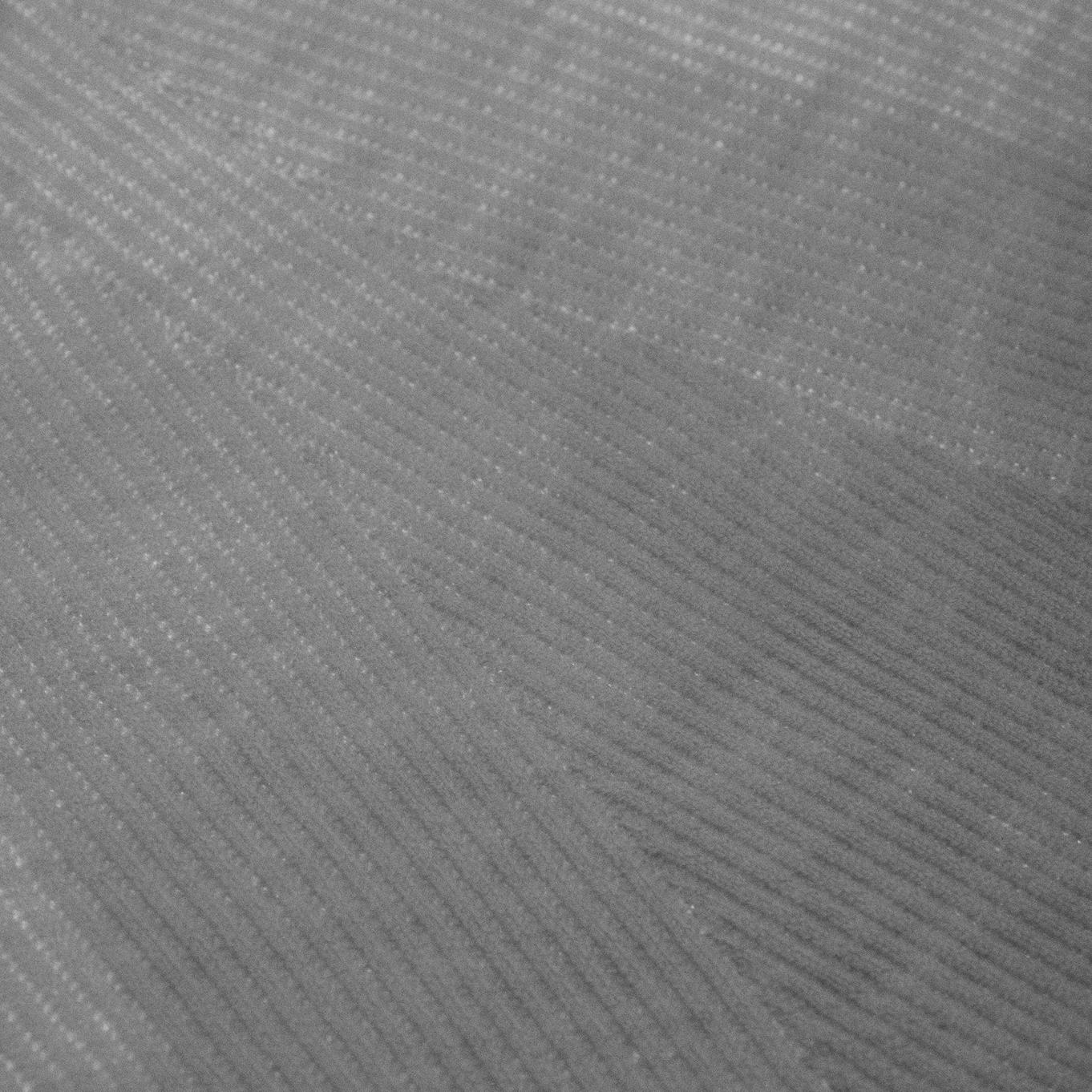 a close up of a gray fabric with a striped pattern.