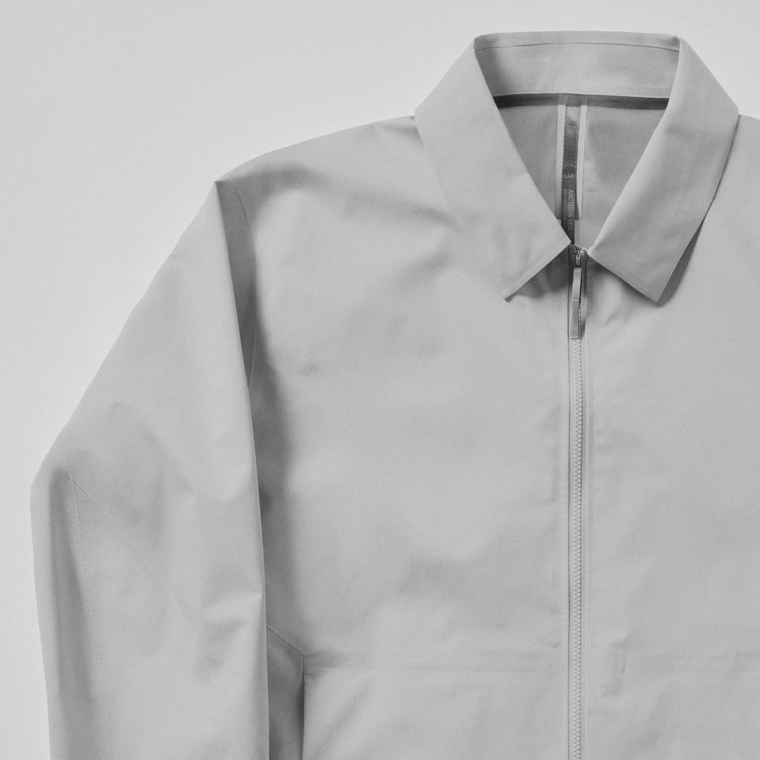 Light grey zippered jacket with a collar.