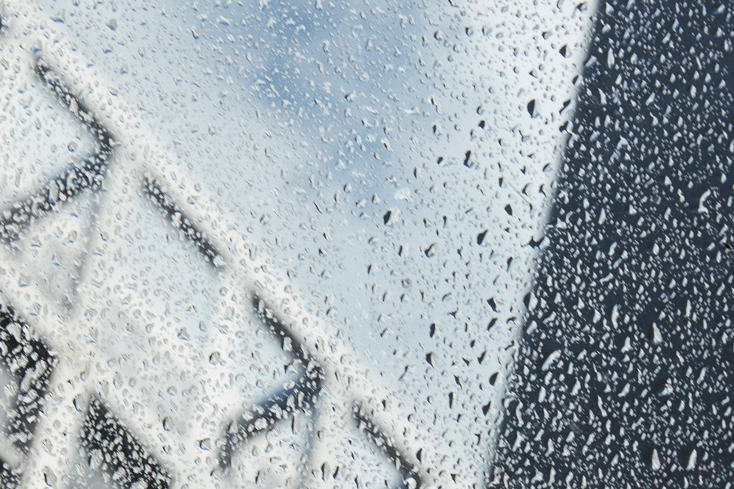 a close up of rain drops on a window