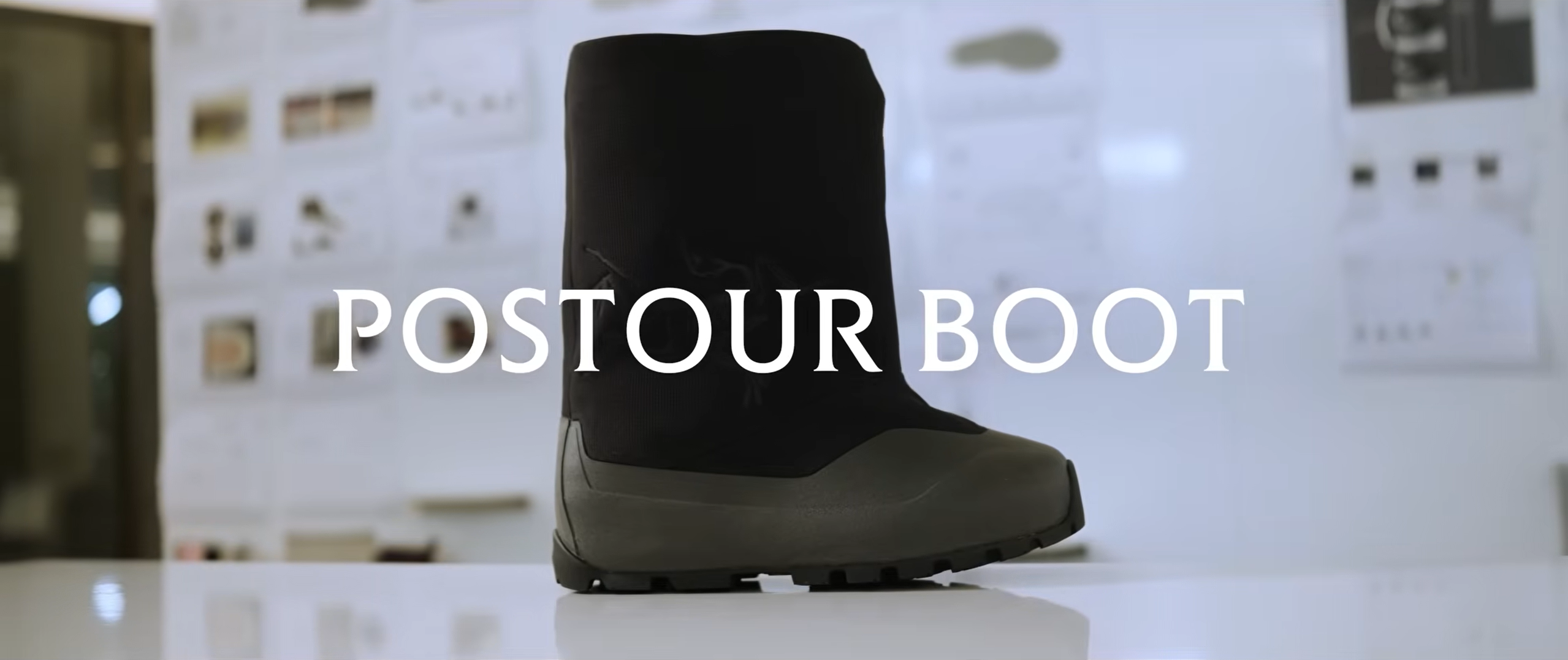 A black and dark green boot with the text "POSTOUR BOOT" overlaid.