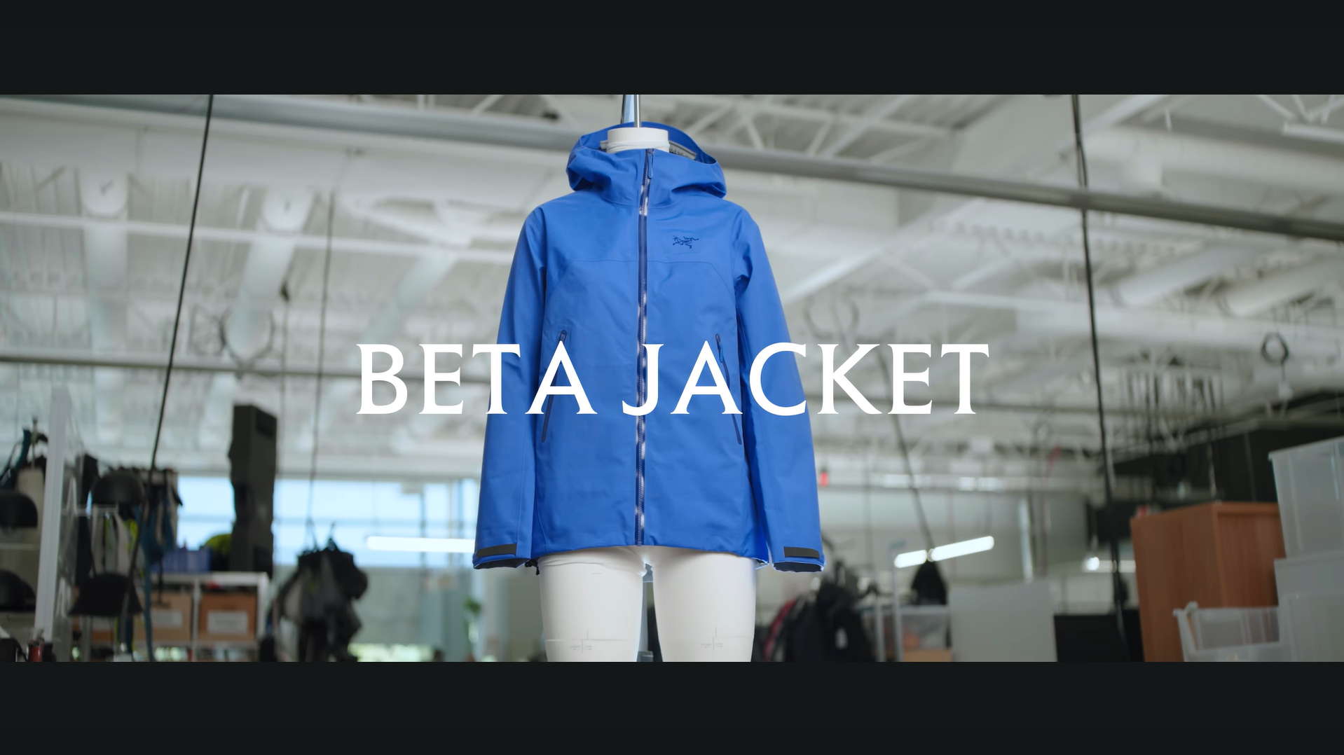 Blue Arc'teryx Beta jacket on a mannequin with "BETA JACKET" text overlaid.