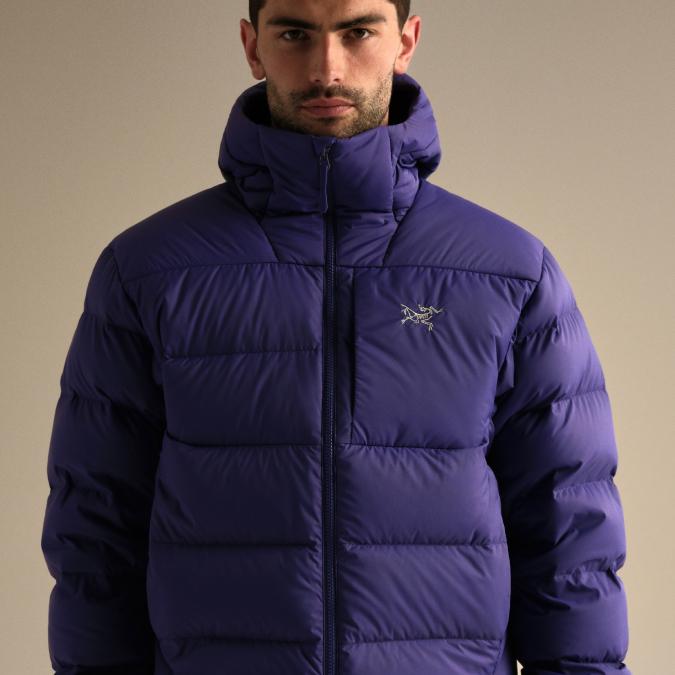 A man in a vibrant purple Arc'teryx puffer jacket.