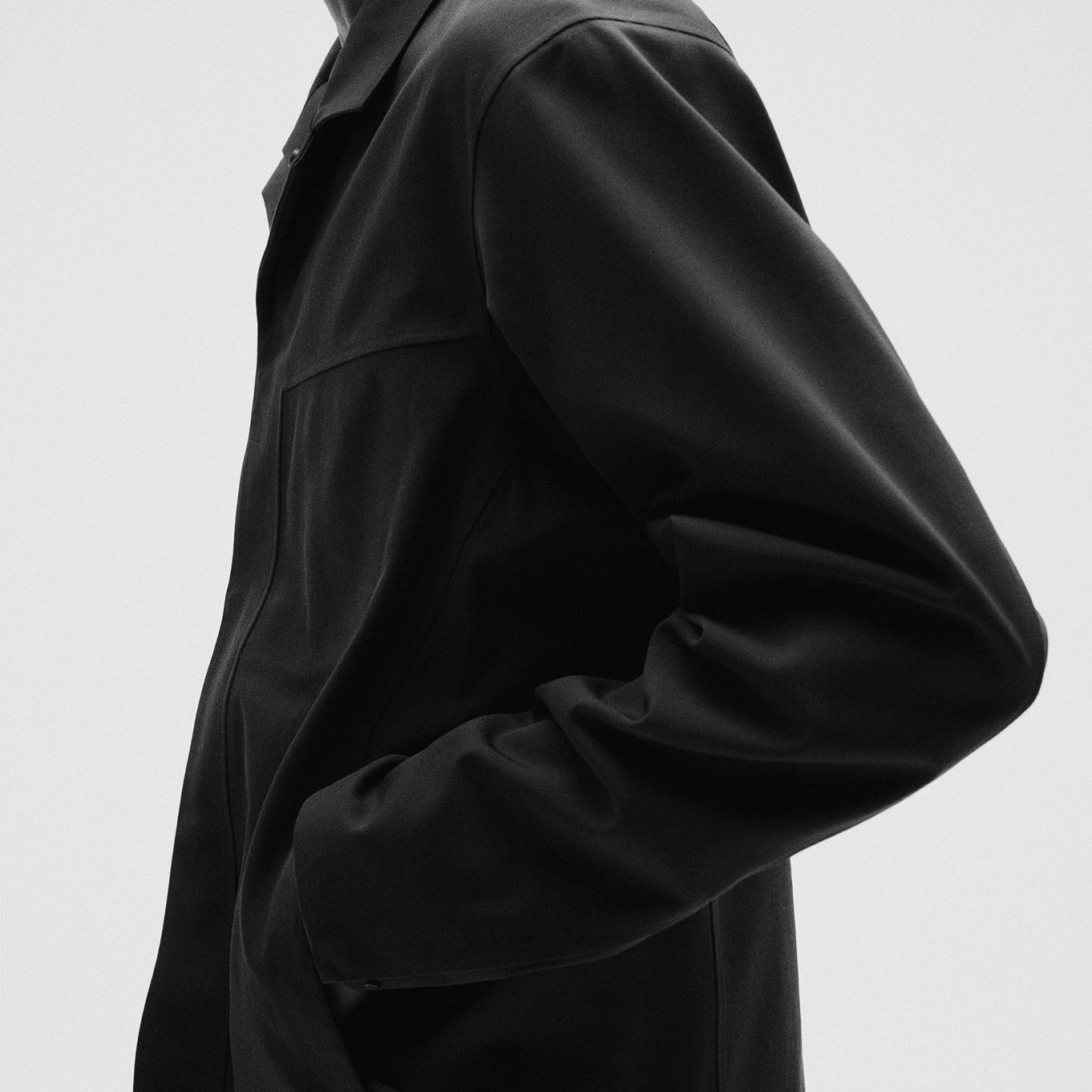 a close up of a person wearing a black jacket