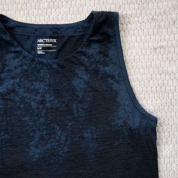 Arc'teryx dark blue mottled tank top on a light textured surface.