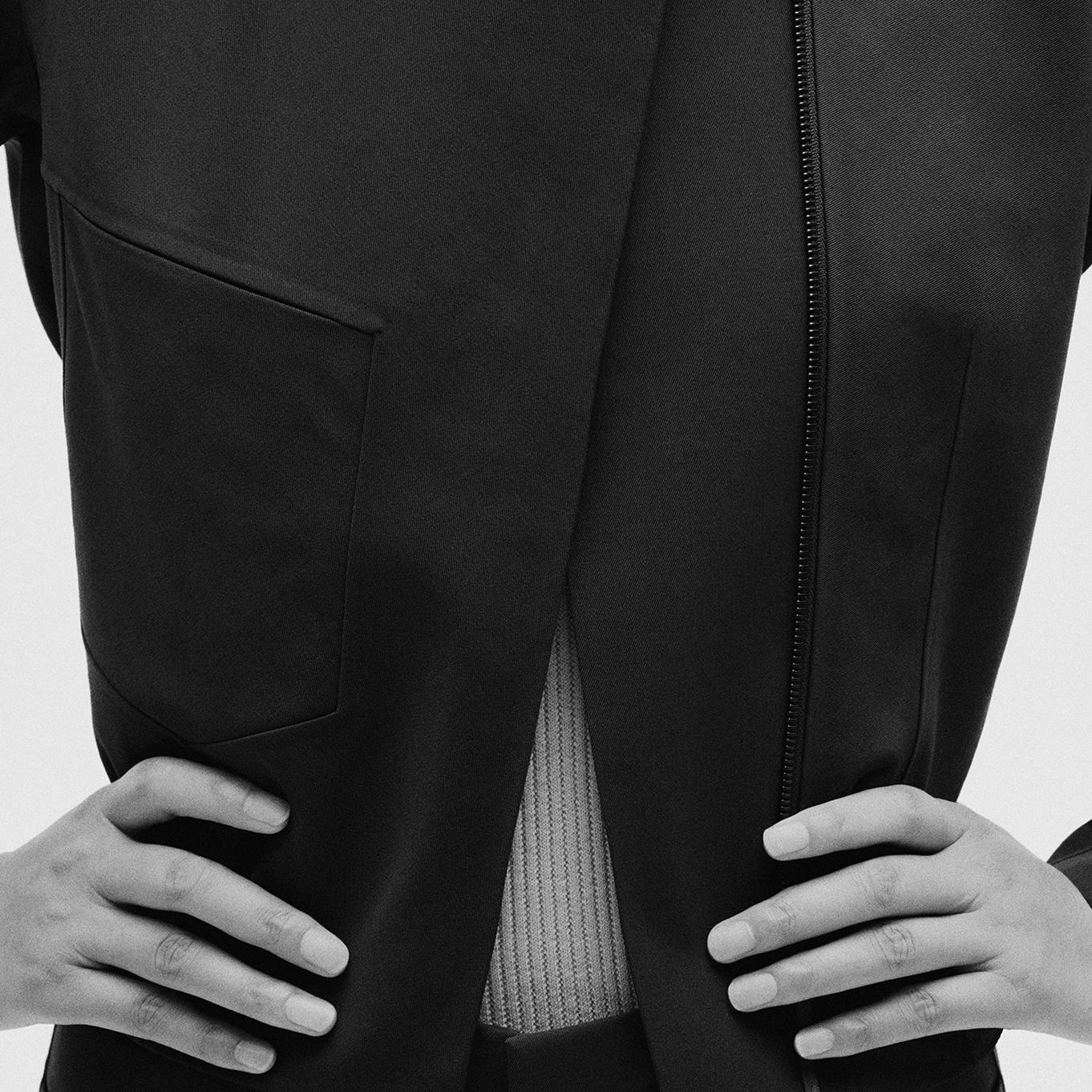 a black and white photo of a person's hands on their hips