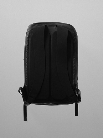 Back view of a black backpack.