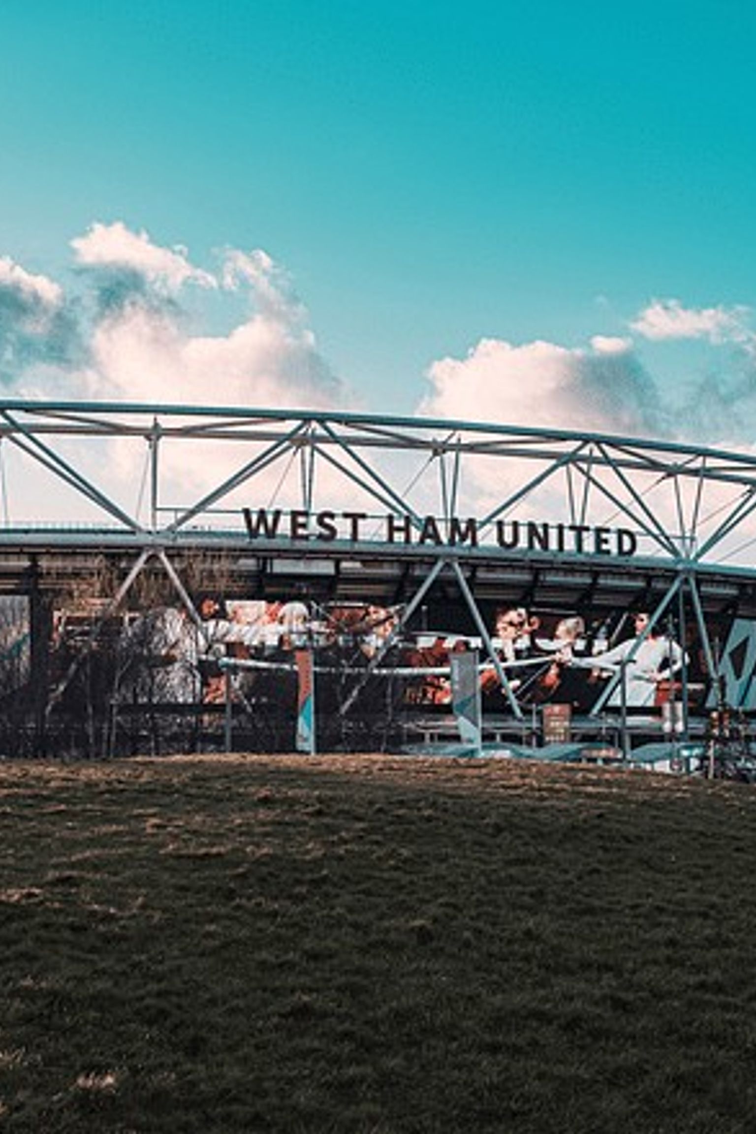 a large stadium with graffiti on the side of it