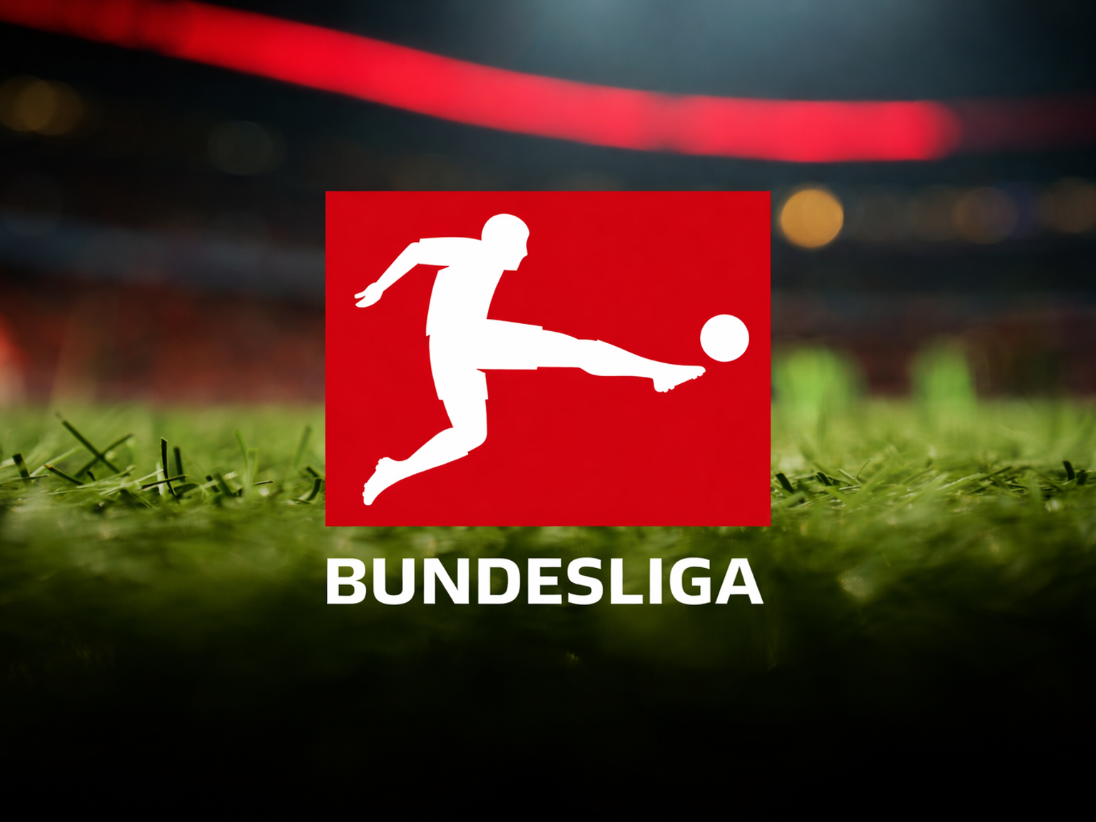 Bundesliga-Logo und Text auf einem Fußballplatz.