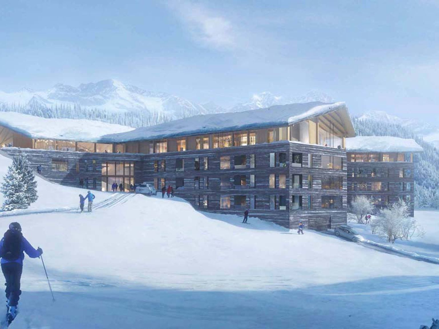 en kvinde står på ski ned ad en sneklædt skråning foran en stor bygning