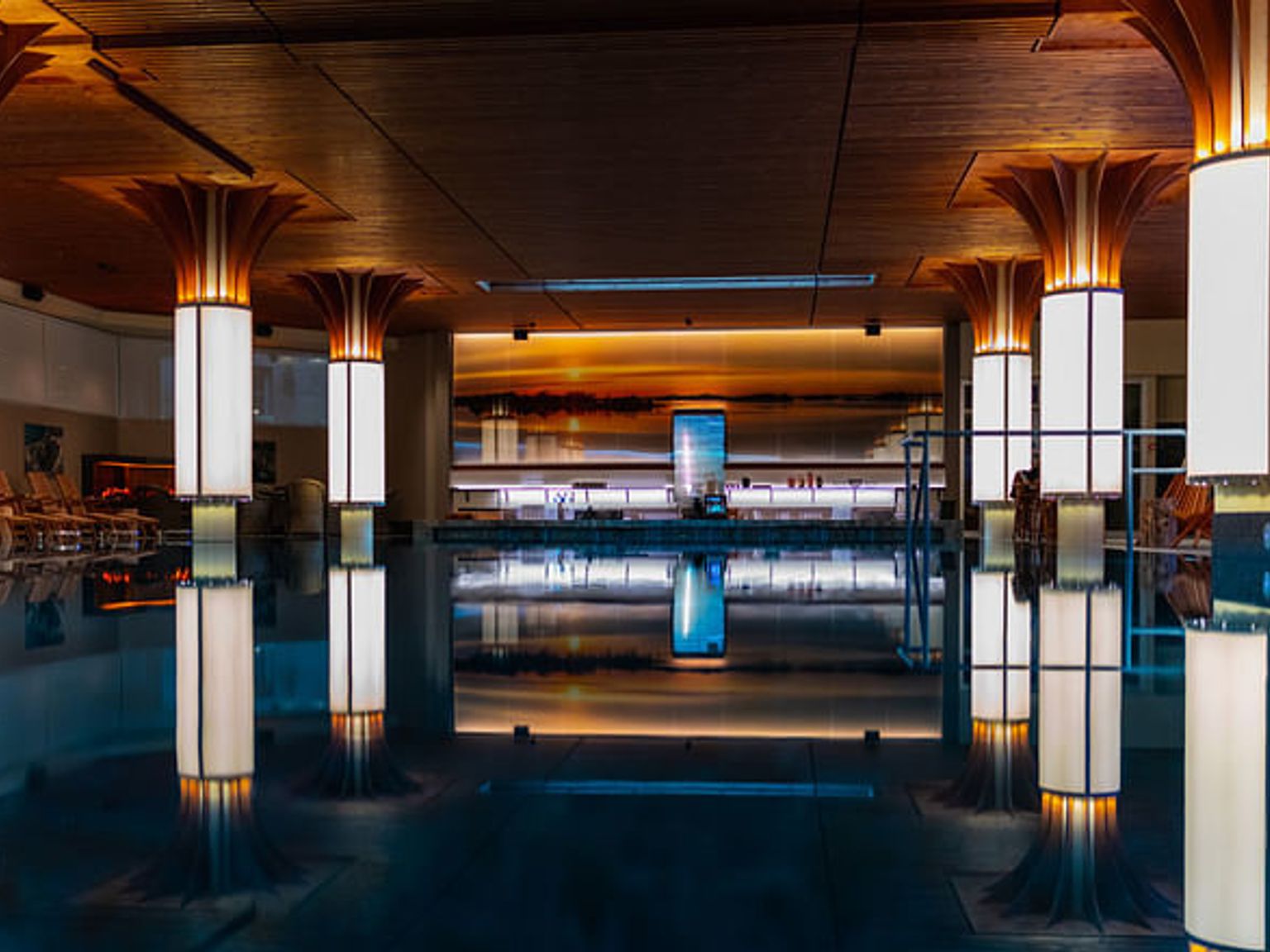 there is a large swimming pool in the middle of the room