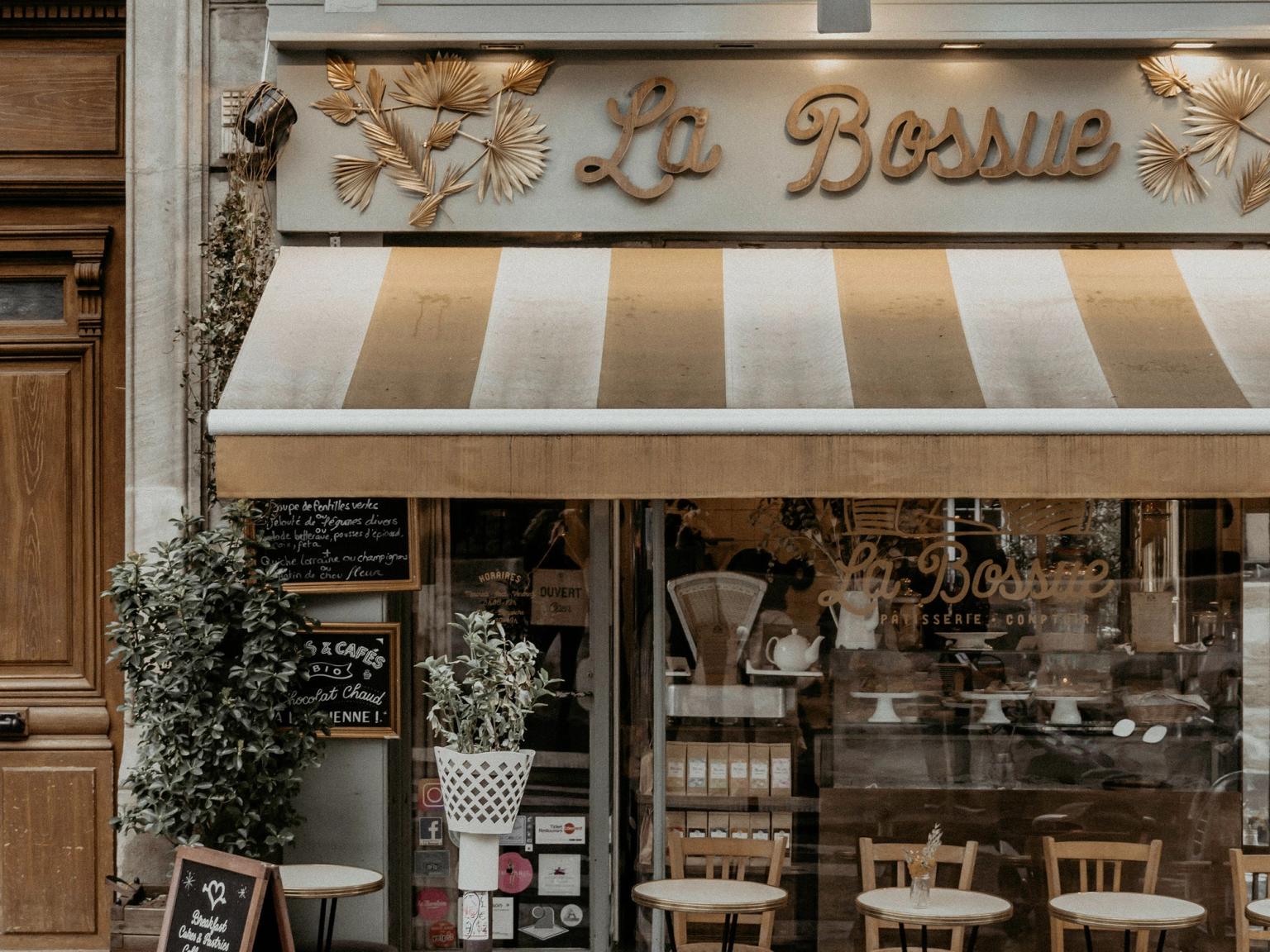 a restaurant called la bossue has tables and chairs outside