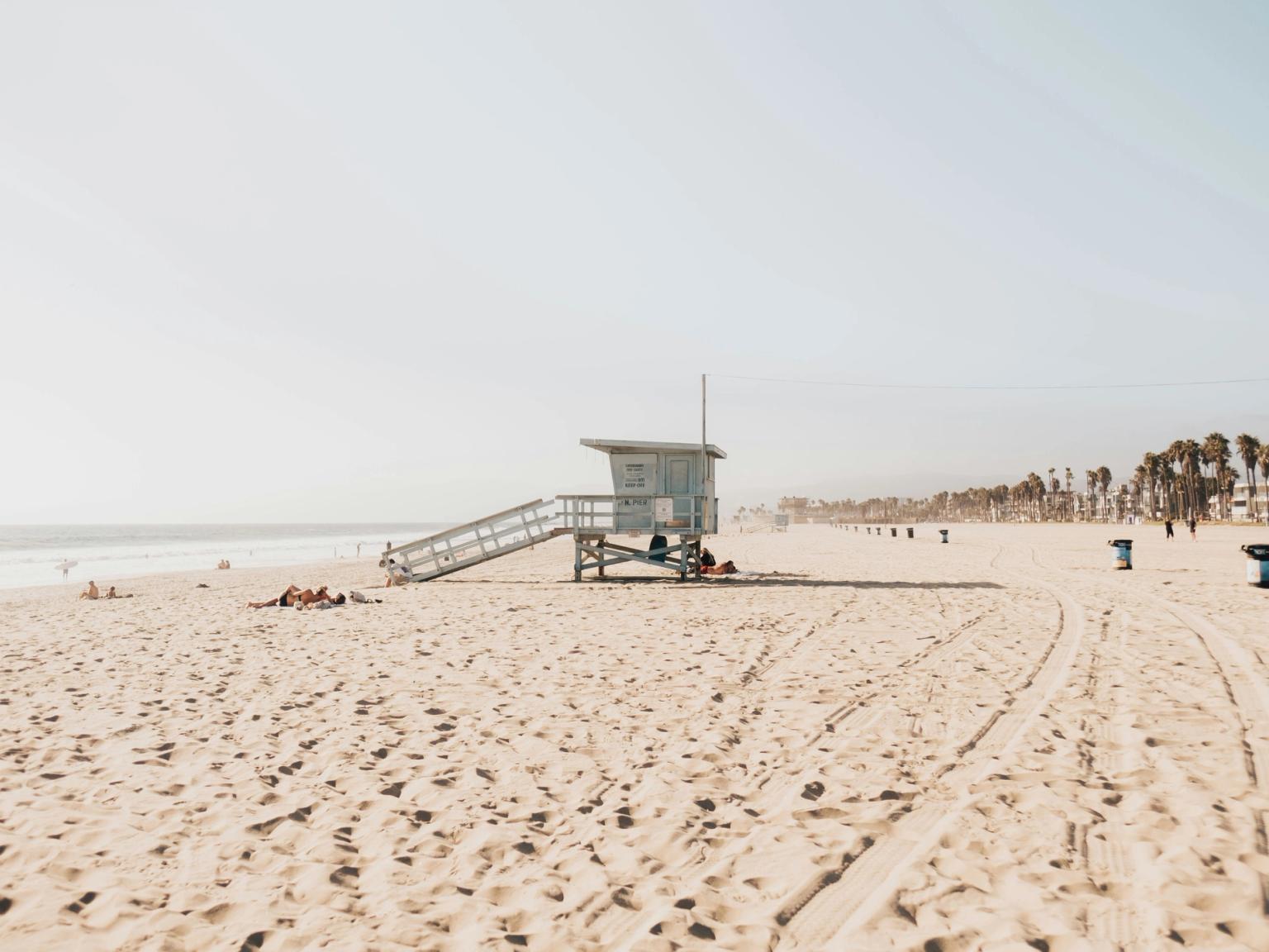 there is a lifeguard tower on the beach