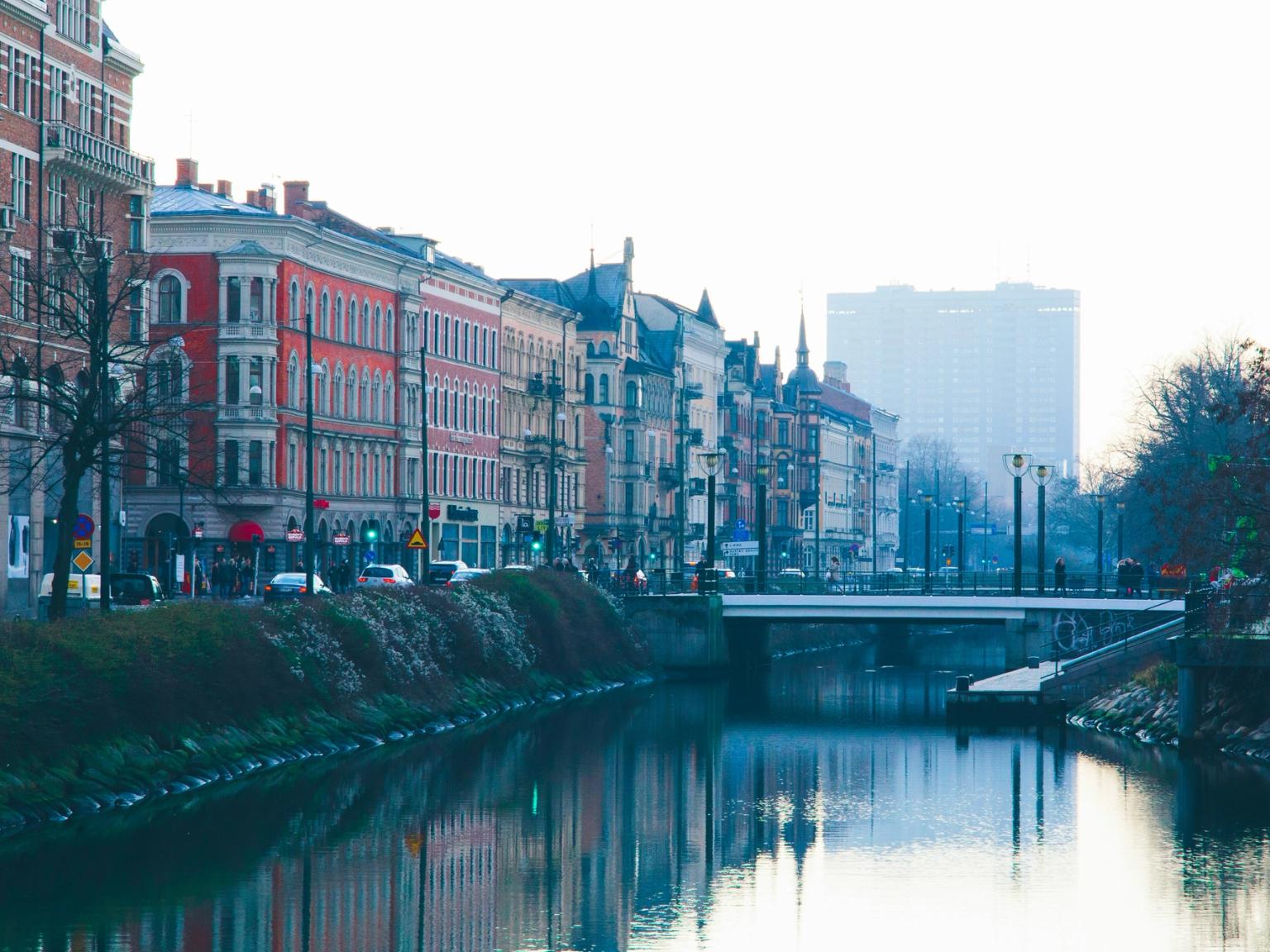there is a bridge over a river in the middle of a city