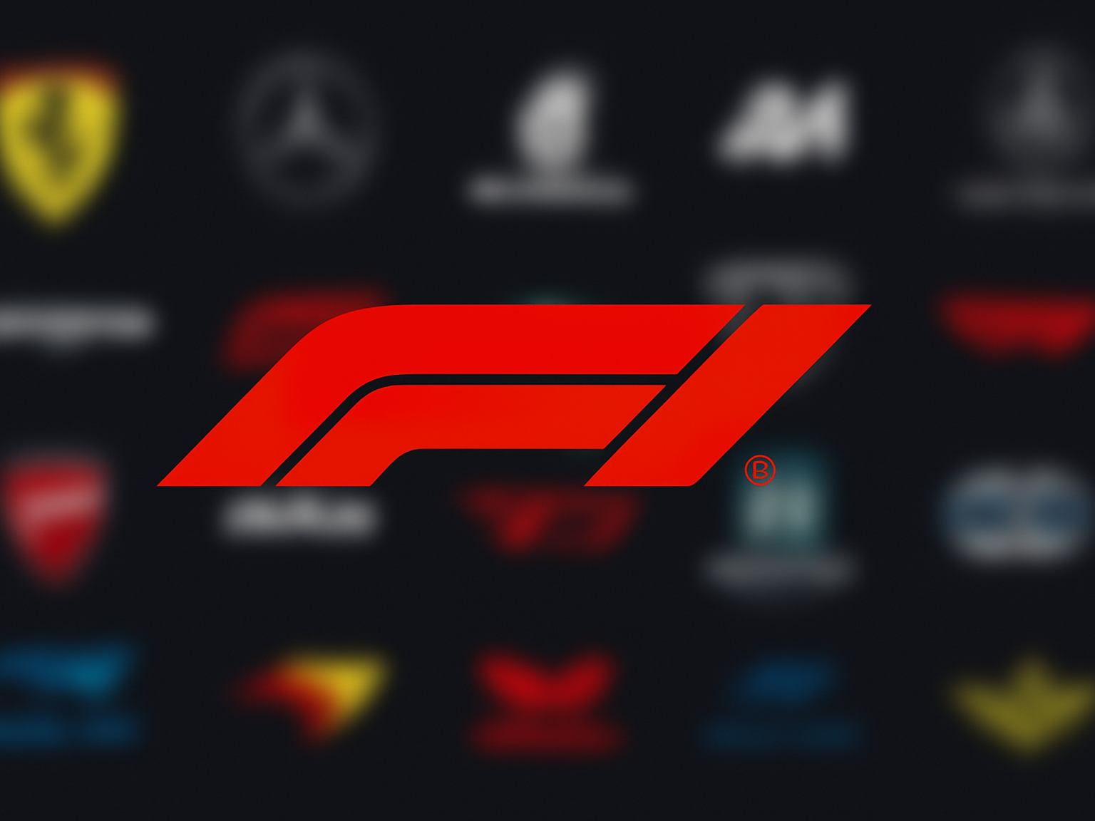 Czerwone logo F1 na rozmytym tle różnych logo zespołów motorsportowych.