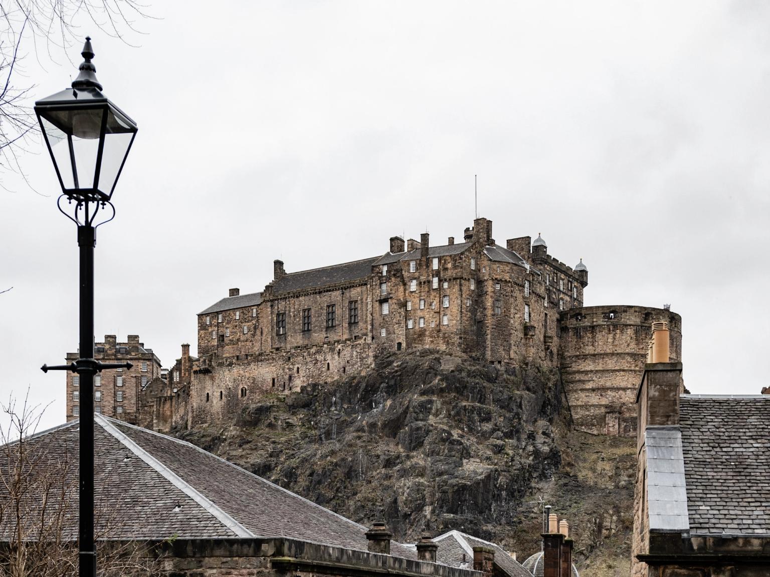 stairs leading up to a castle with a sign that says 'scottish' on it