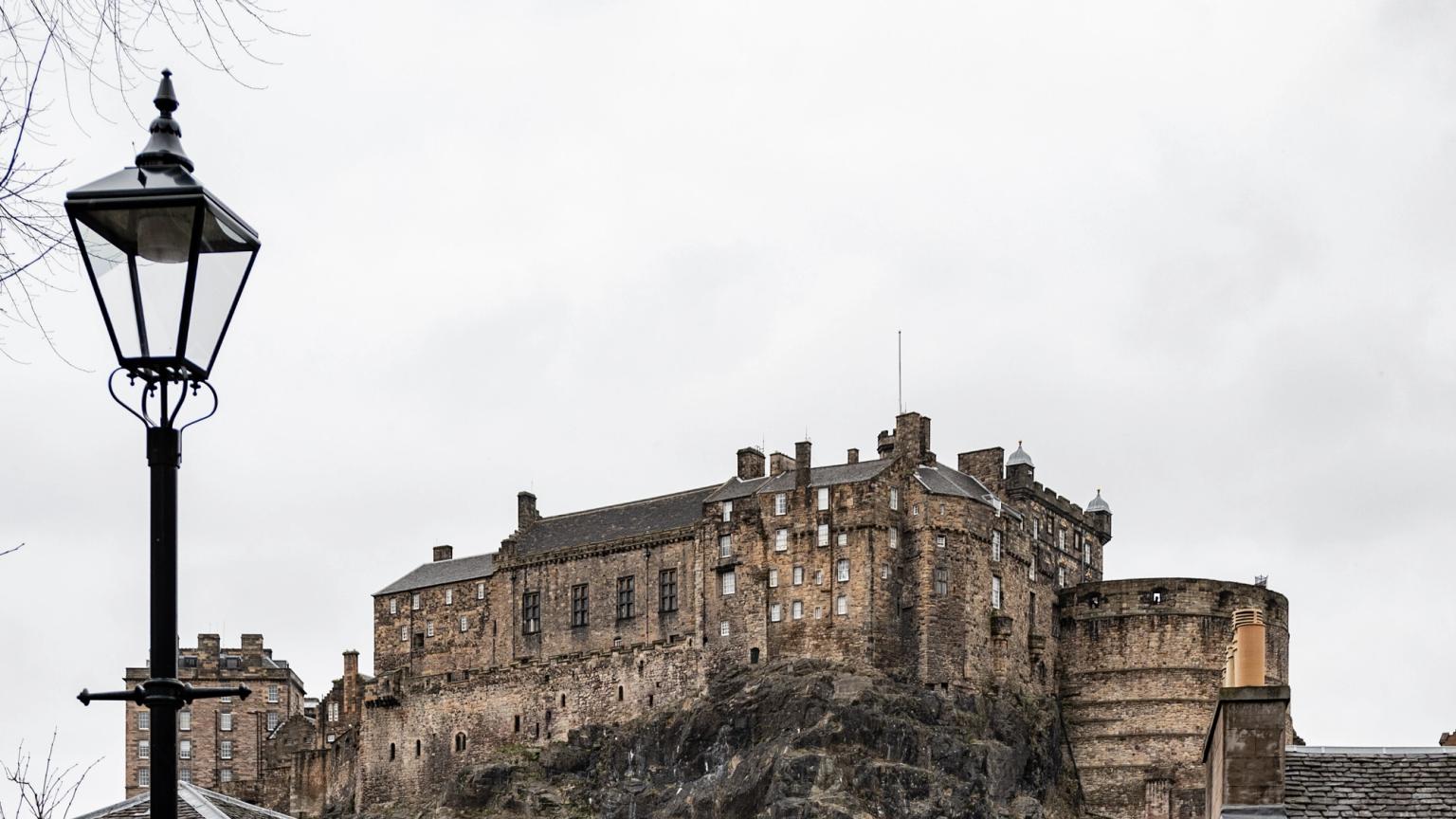 stairs leading up to a castle with a sign that says 'scottish' on it