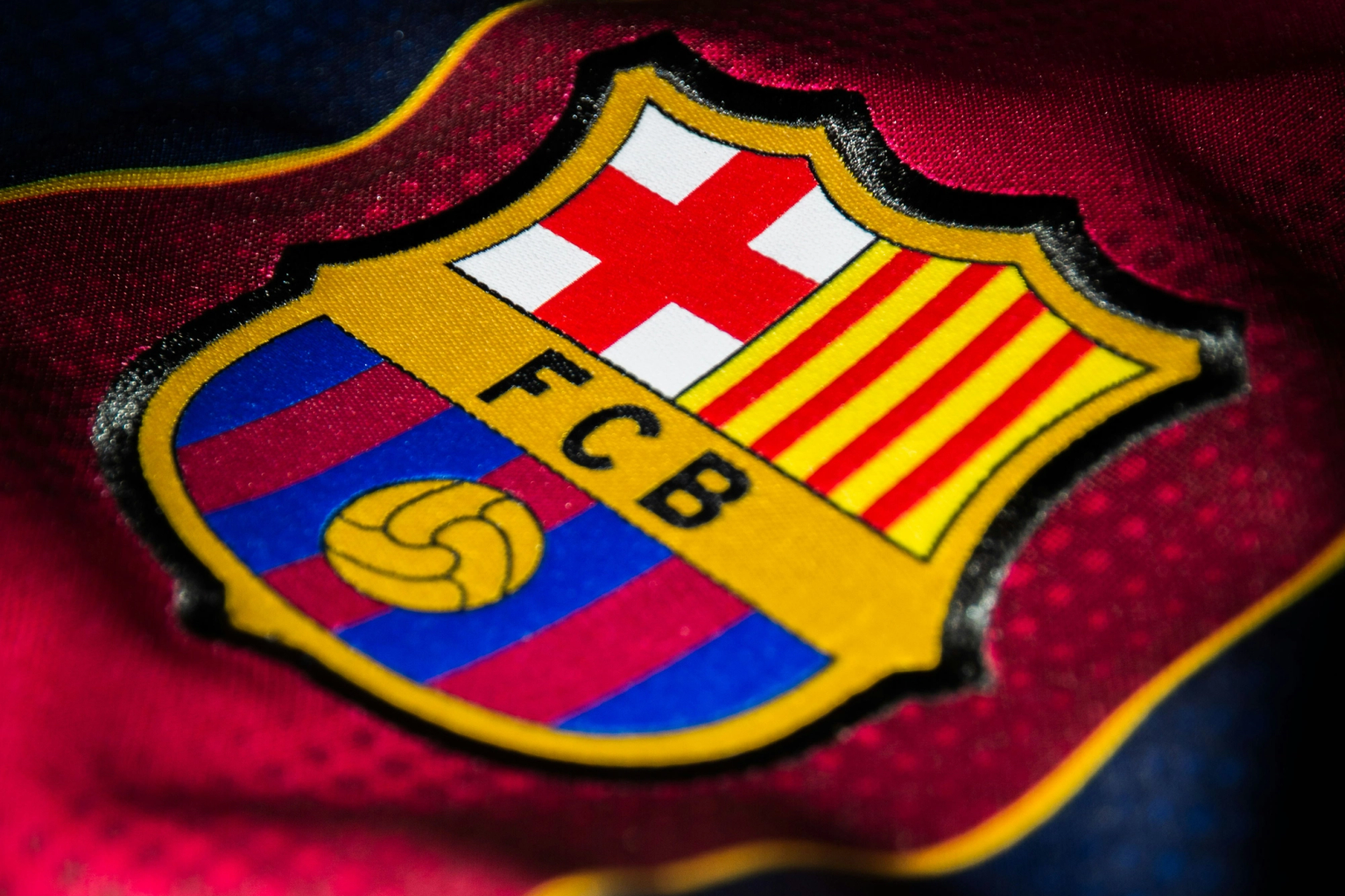 Close-up of the FC Barcelona crest on a jersey.