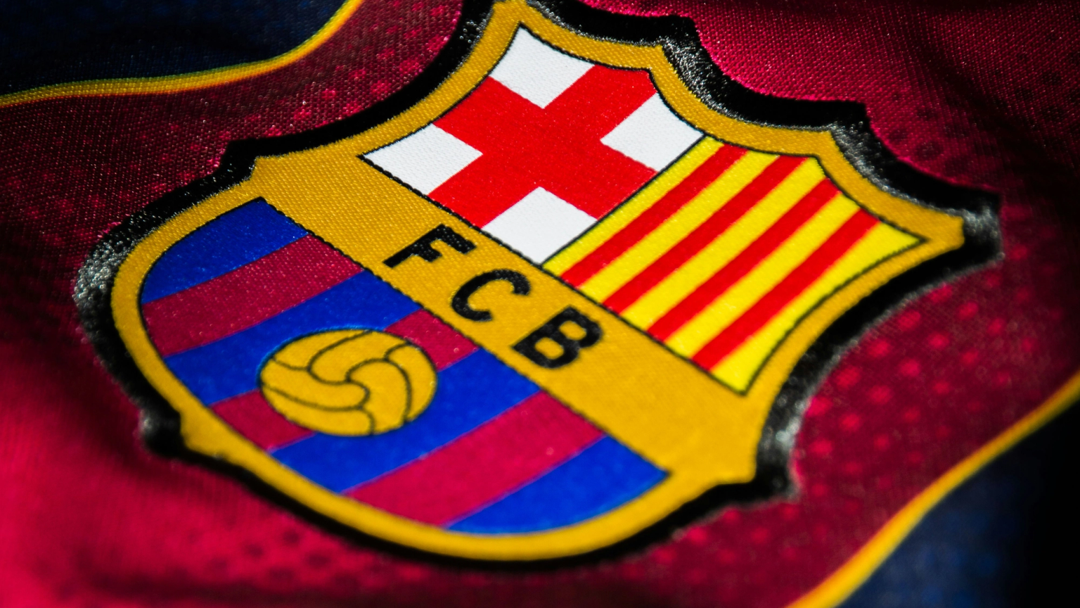 Close-up of the FC Barcelona crest on a jersey.
