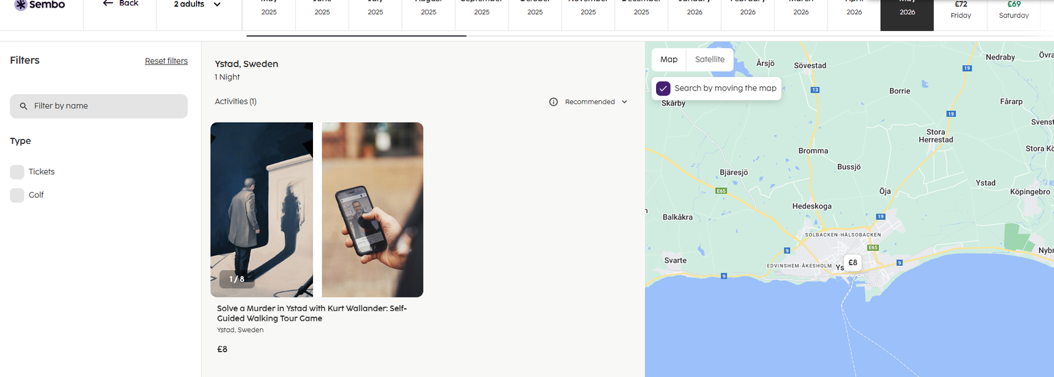 a person holding a cell phone next to a map