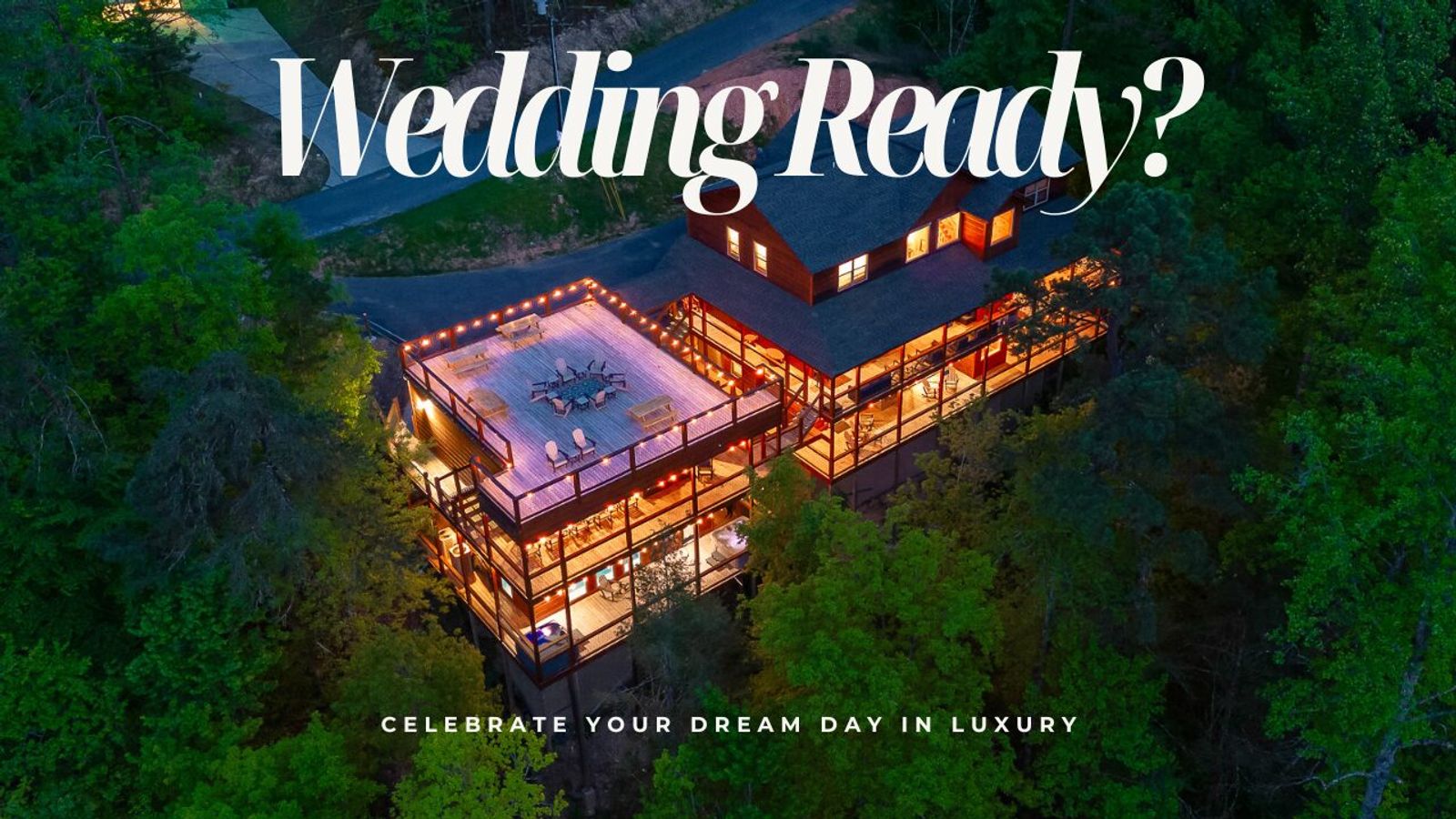 Aerial view of a large, well-lit cabin surrounded by trees at dusk with text overlay: Wedding Ready? Discover one of the top wedding venues and celebrate your dream day in luxury.