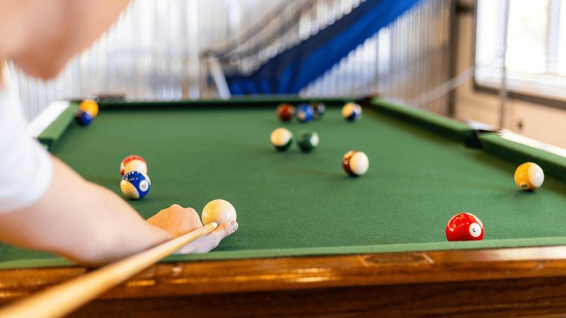 A person playing pool.