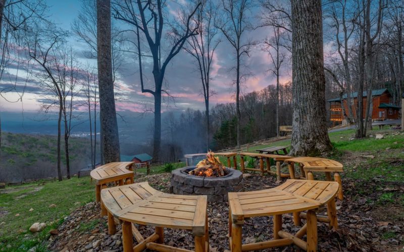 View of Smoky Mountains at dusk with scattered cabins.